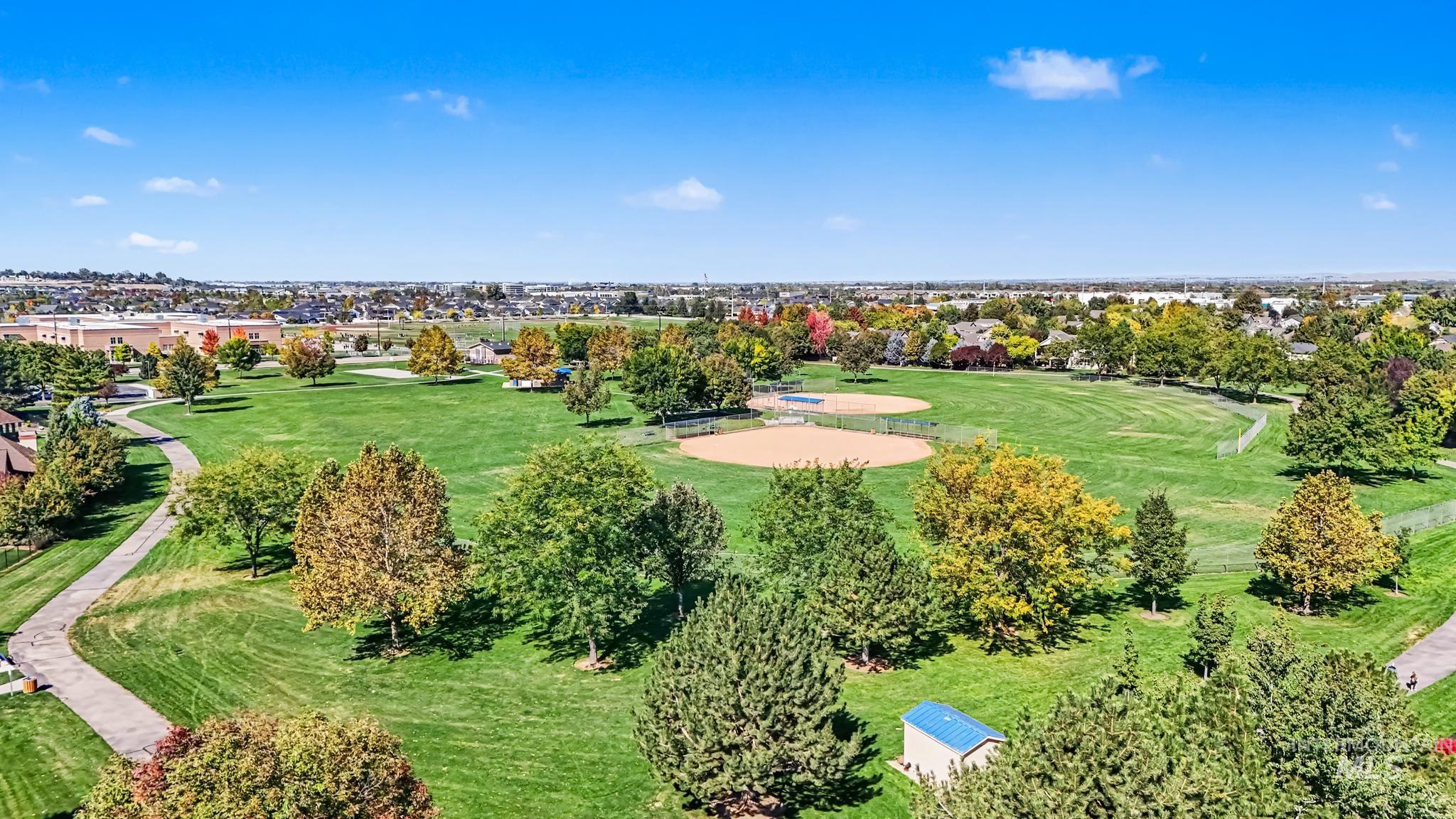 2340 South Alaska Way Meridian, ID 83642 - Photo 43 of 48 Expansive green space featuring mature trees, paved pathways, and multiple baseball fields