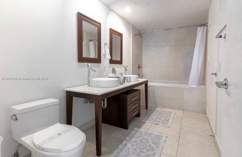 485 Brickell Avenue, Unit 2606 Miami, FL 33131 - Photo 14 of 18 a bathroom with a sink vanity mirror and toilet