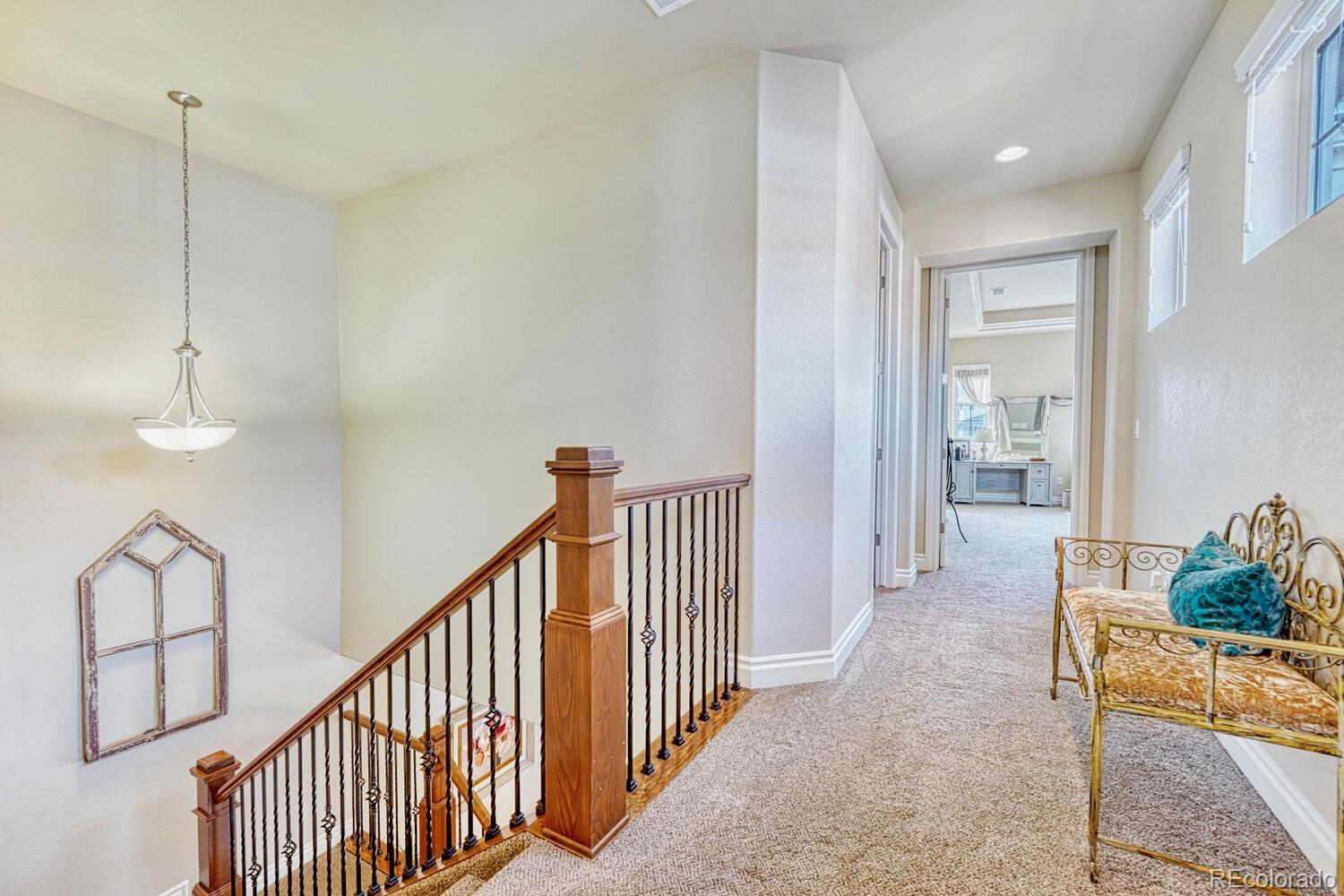 10120 RidgeGate Circle Lone Tree, CO 80124 - Photo 13 of 25 a view of a hallway with furniture and entryway