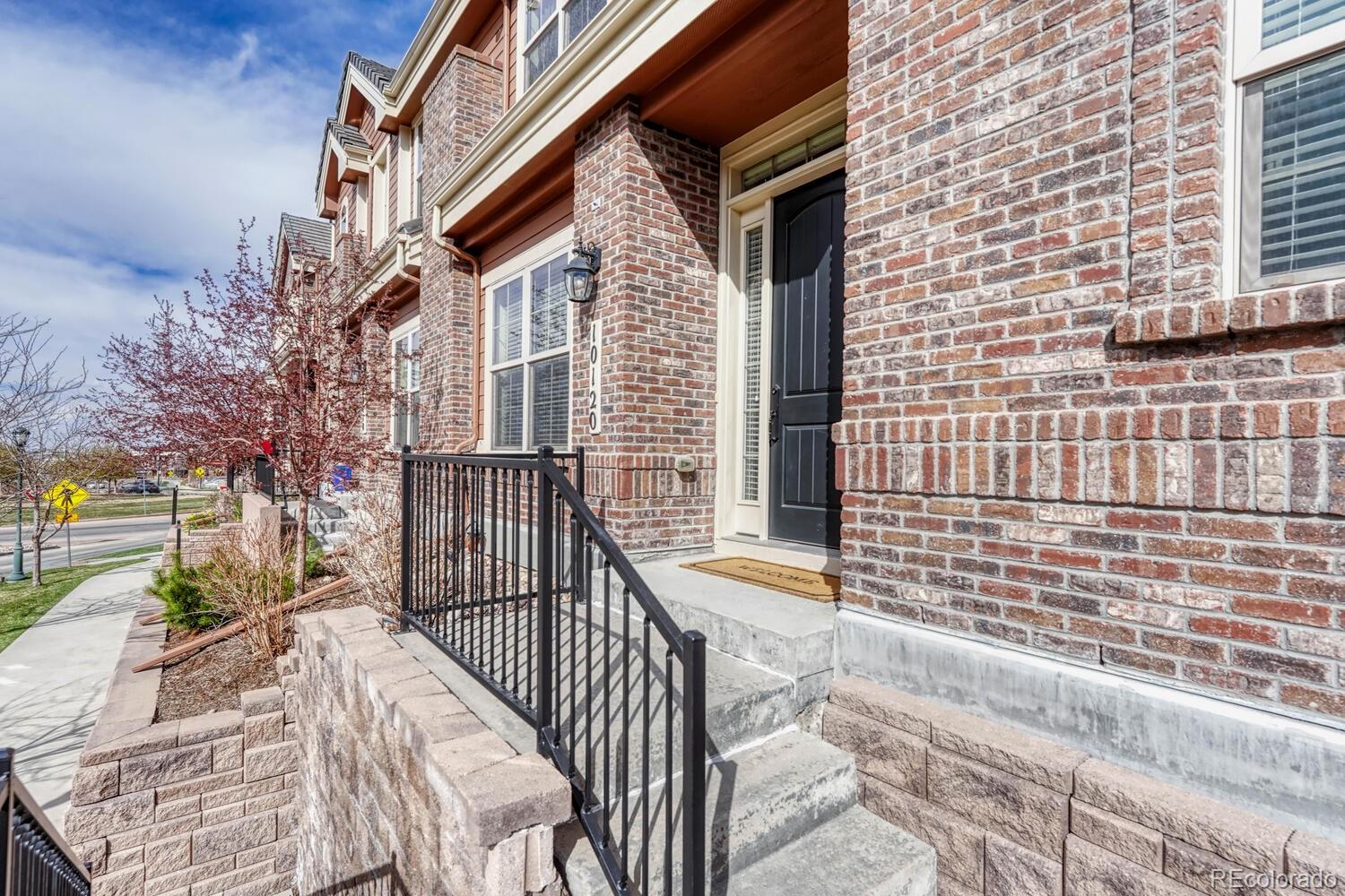 10120 RidgeGate Circle Lone Tree, CO 80124 - Photo 2 of 25 a view of a brick building from a balcony