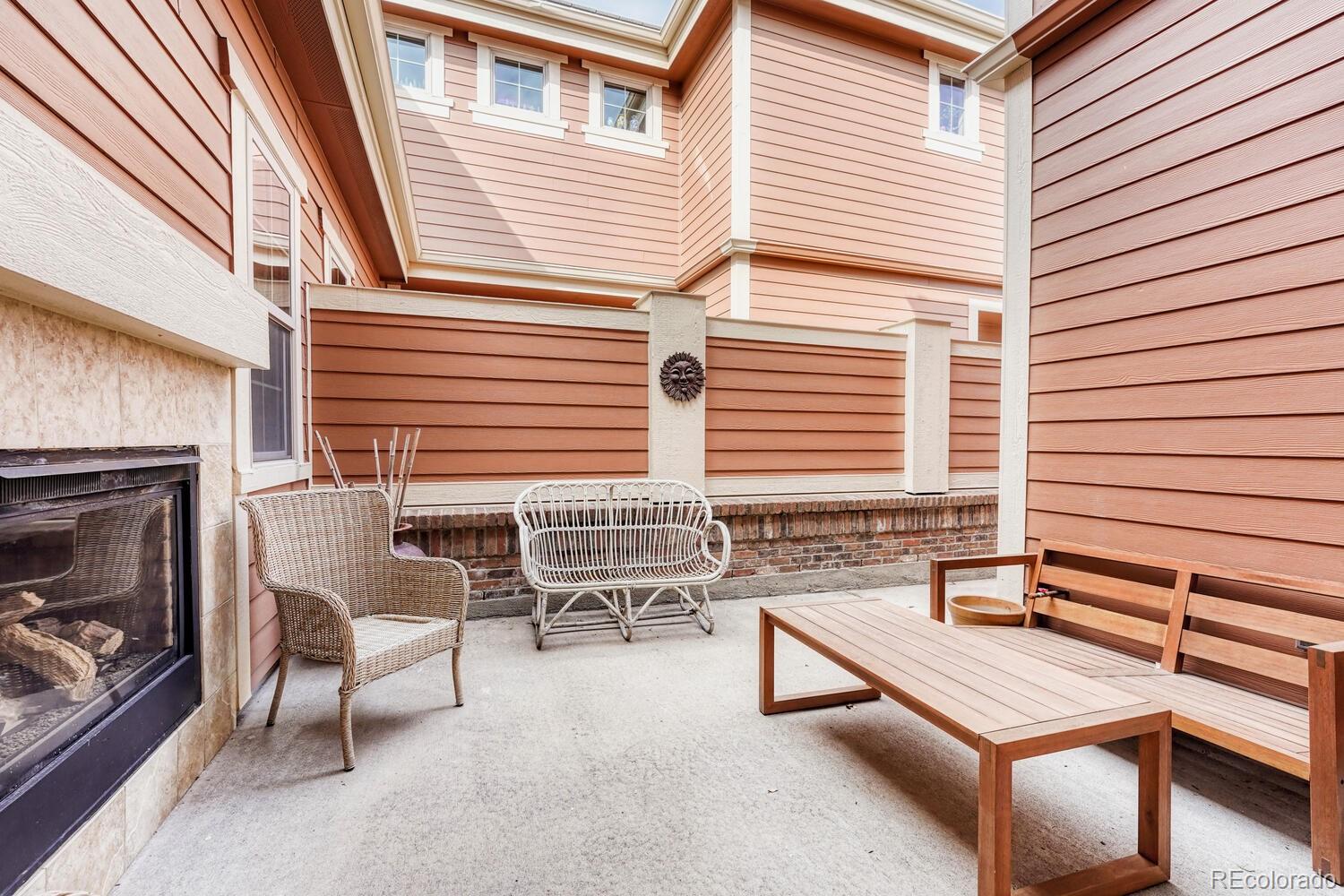 10120 RidgeGate Circle Lone Tree, CO 80124 - Photo 23 of 25 a building outdoor space with patio furniture