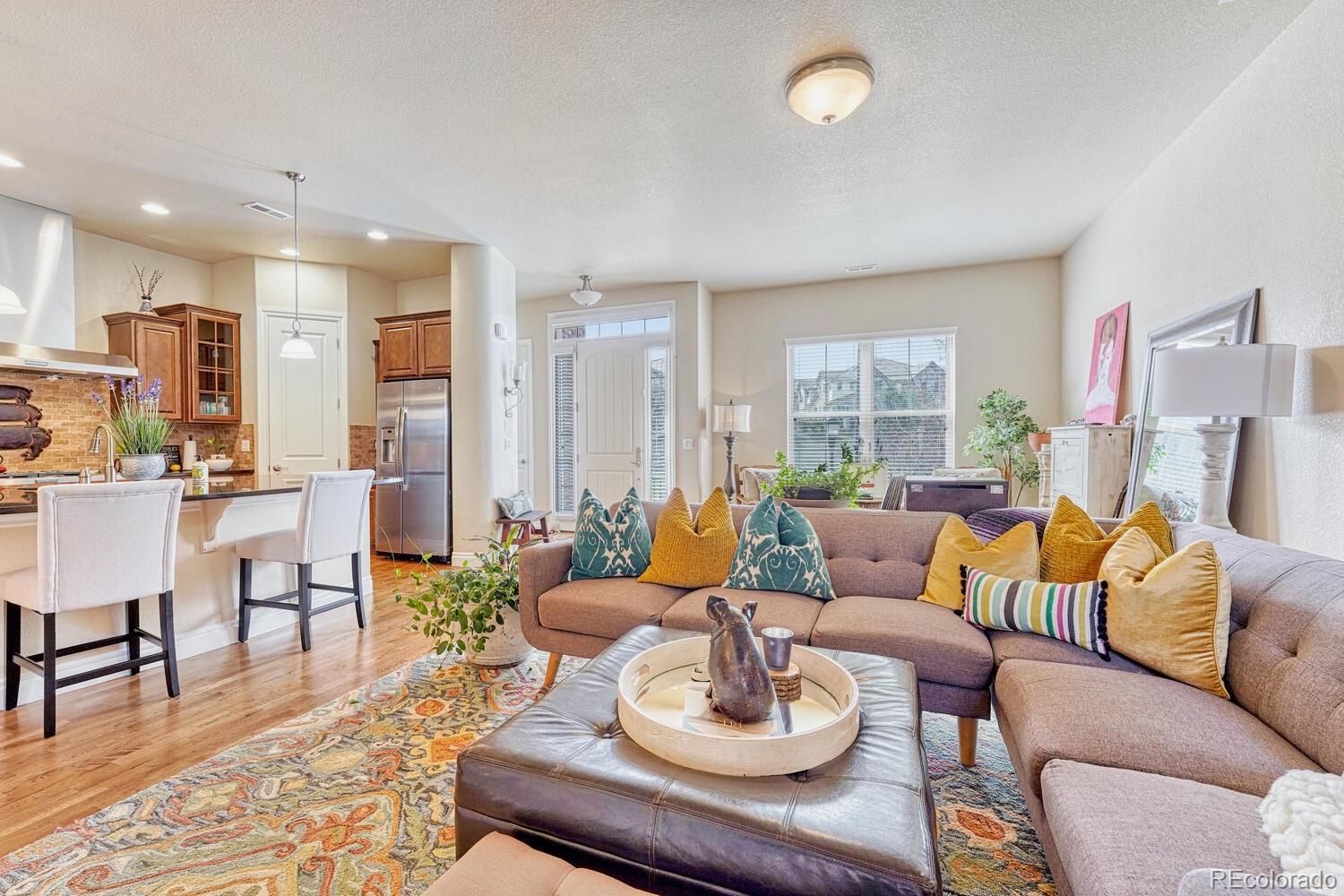 10120 RidgeGate Circle Lone Tree, CO 80124 - Photo 5 of 25 a living room with furniture kitchen and a large window