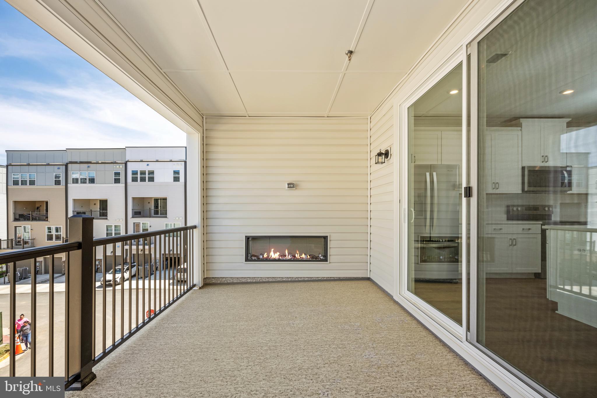 2518 Neabsco Common Place Woodbridge, VA 22191 - Photo 13 of 37 a view of a hallway with wooden floor and a fireplace