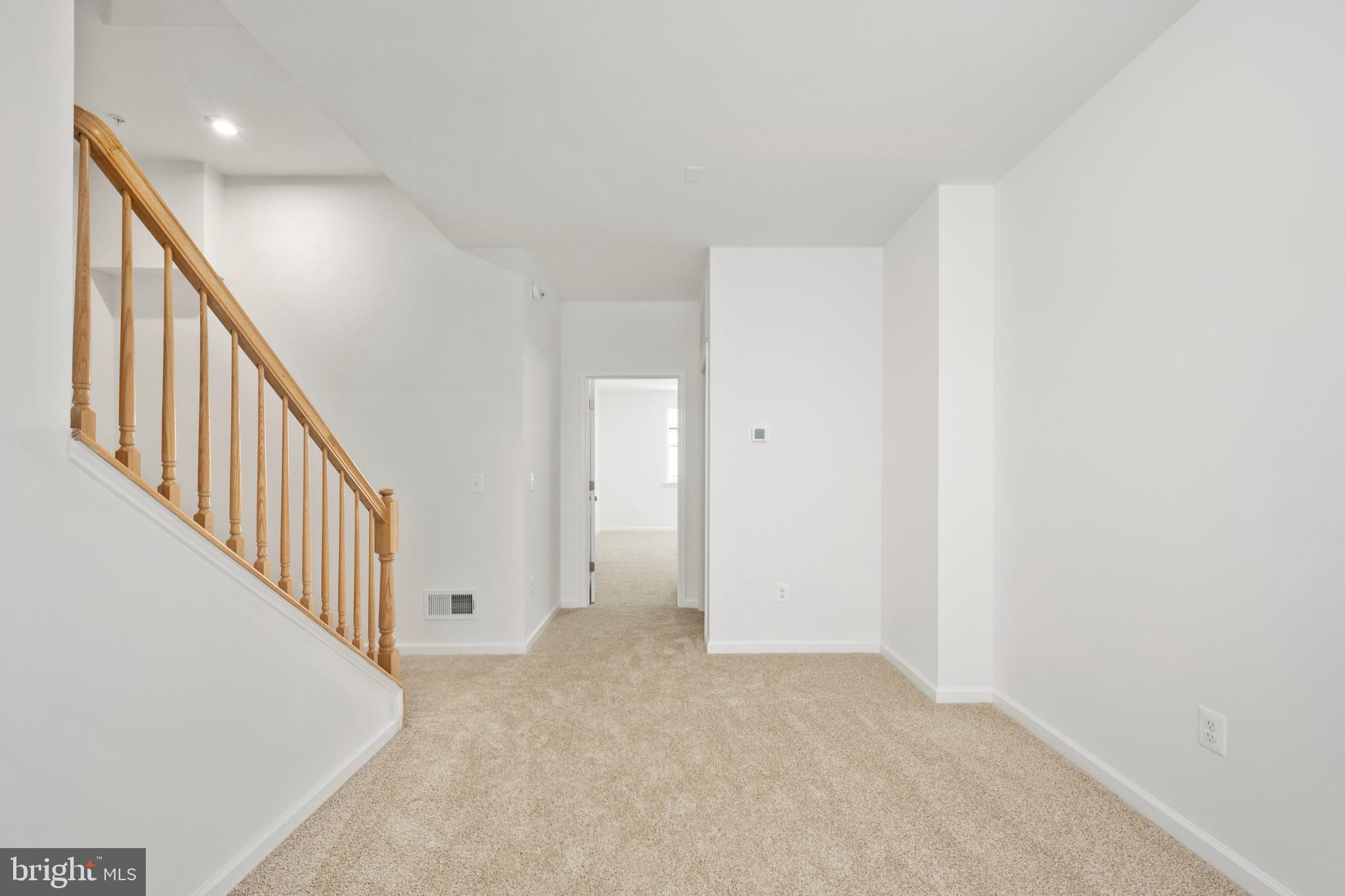 2518 Neabsco Common Place Woodbridge, VA 22191 - Photo 17 of 37 a view of an empty room with wooden floor
