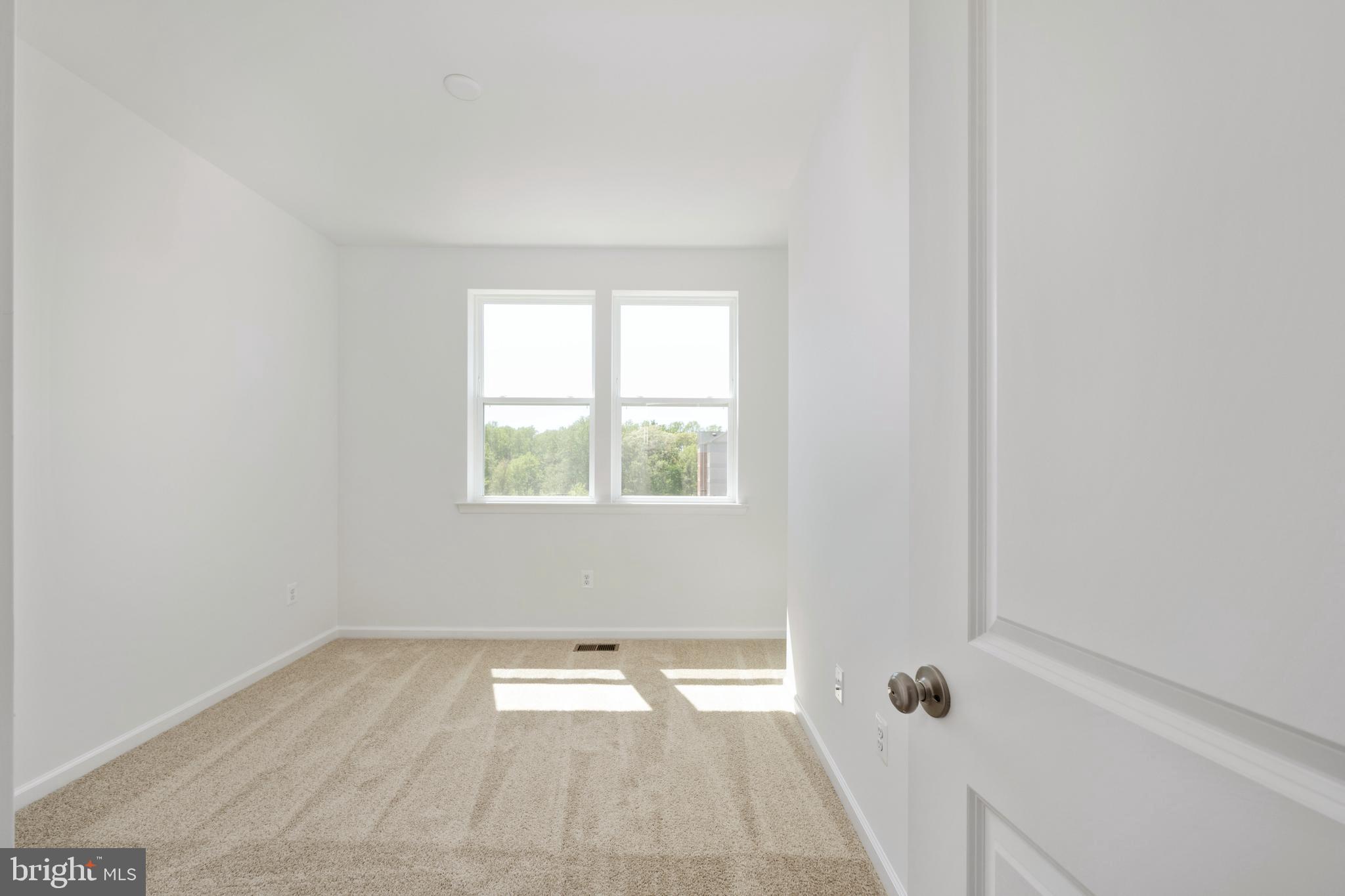 2518 Neabsco Common Place Woodbridge, VA 22191 - Photo 23 of 37 an empty room with a window