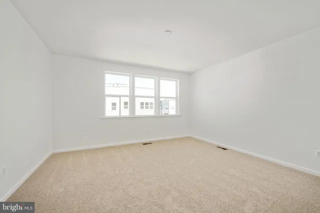 a view of a room with white walls