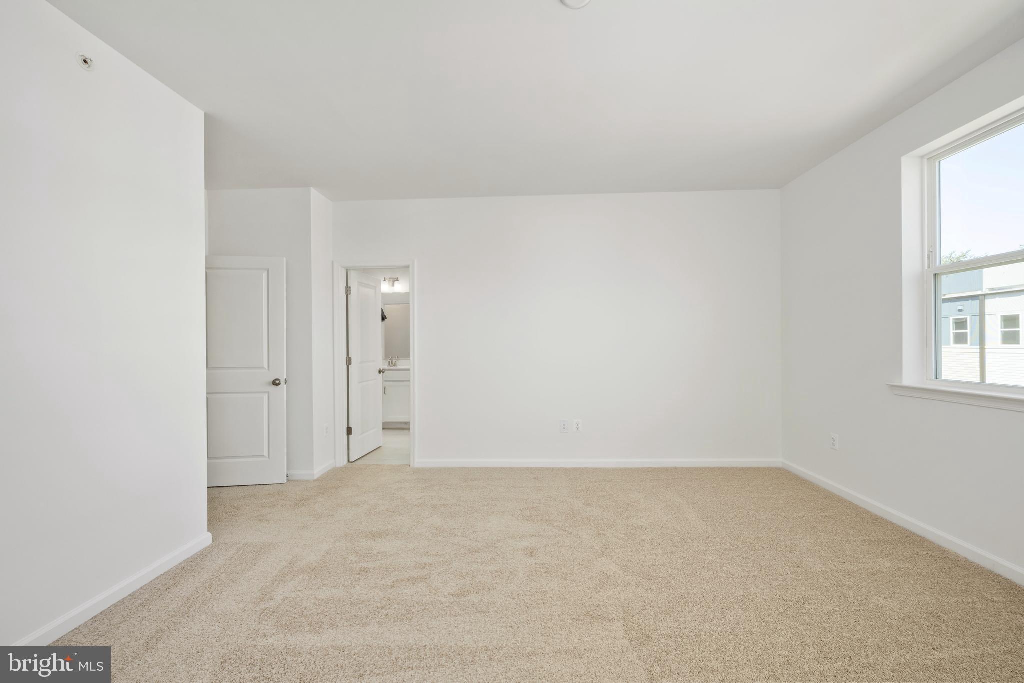 2518 Neabsco Common Place Woodbridge, VA 22191 - Photo 27 of 37 an empty room with windows and closet