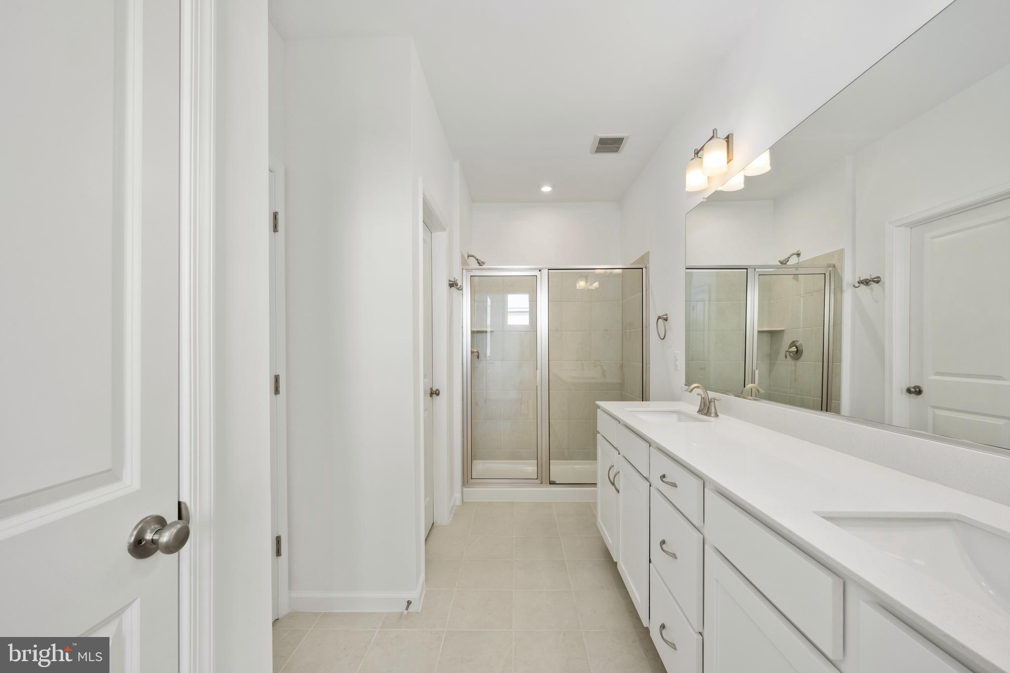 2518 Neabsco Common Place Woodbridge, VA 22191 - Photo 28 of 37 a spacious bathroom with a double vanity sink mirror and shower