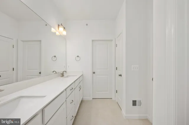 a bathroom with a shower and a sink