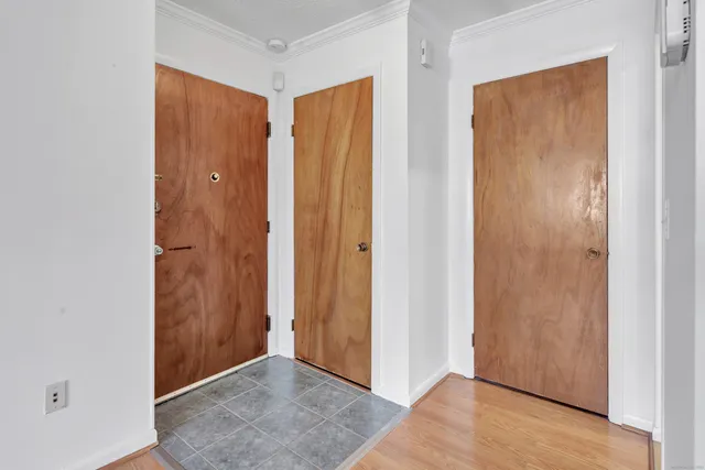 an empty room with closet area