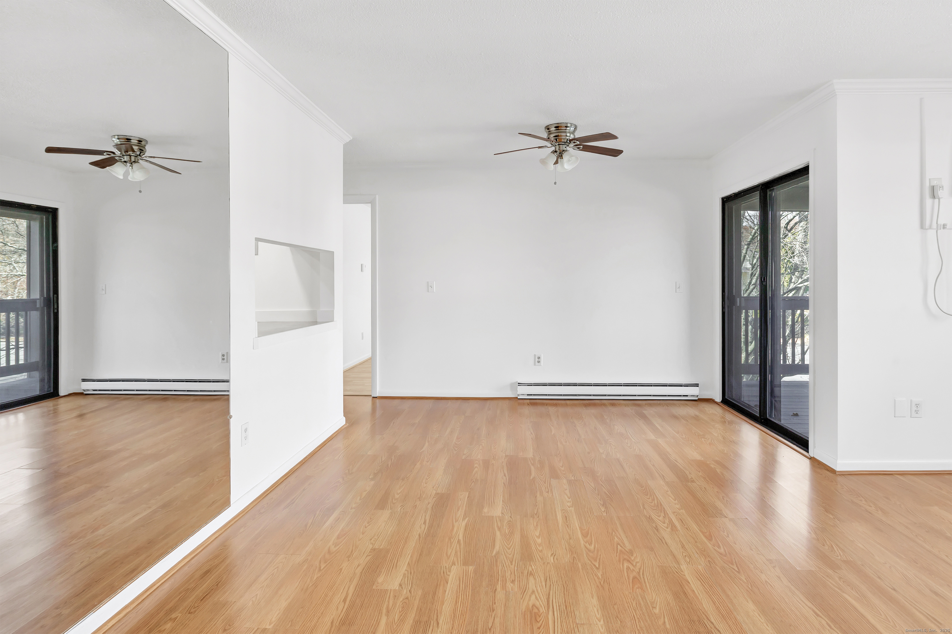 3012 Madison Avenue, Unit F Bridgeport, CT 06606 - Photo 14 of 18 wooden floor in an empty room with a window
