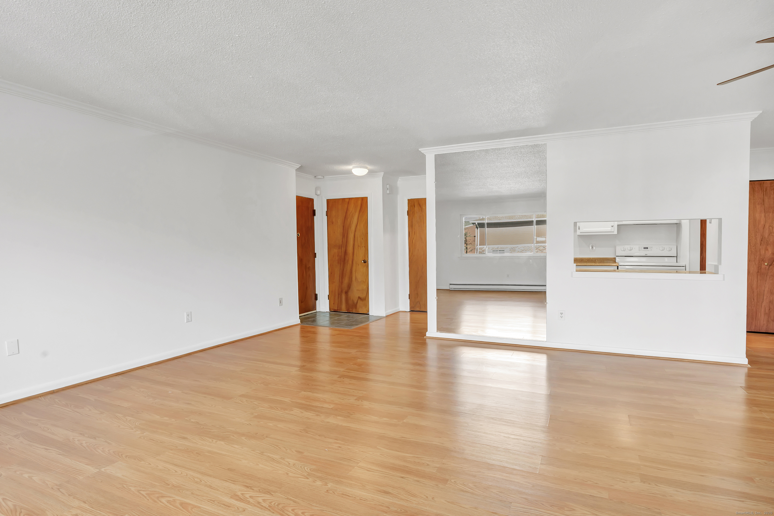 3012 Madison Avenue, Unit F Bridgeport, CT 06606 - Photo 16 of 18 a view of empty room with wooden floor