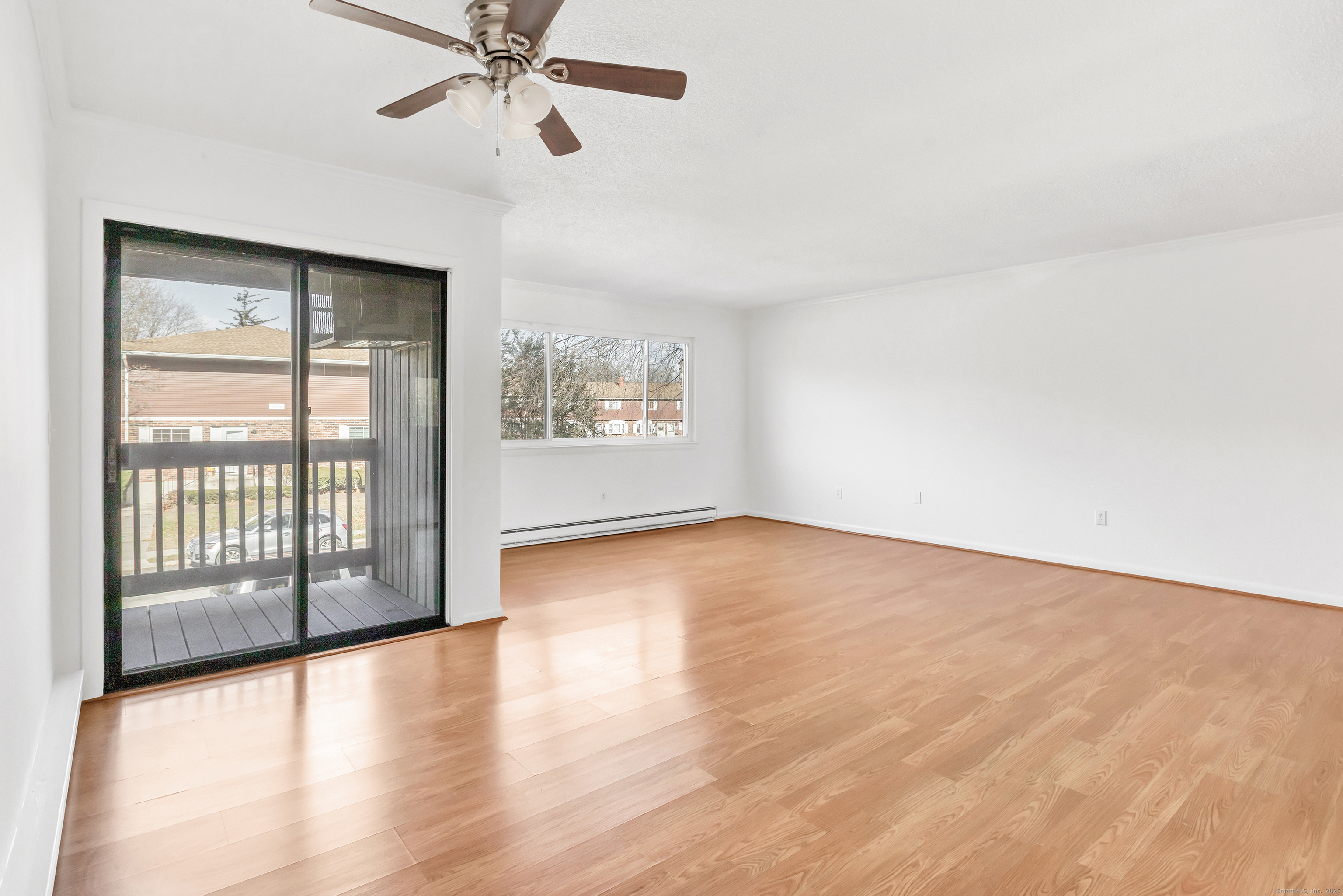 3012 Madison Avenue, Unit F Bridgeport, CT 06606 - Photo 18 of 18 wooden floor in an empty room with a window