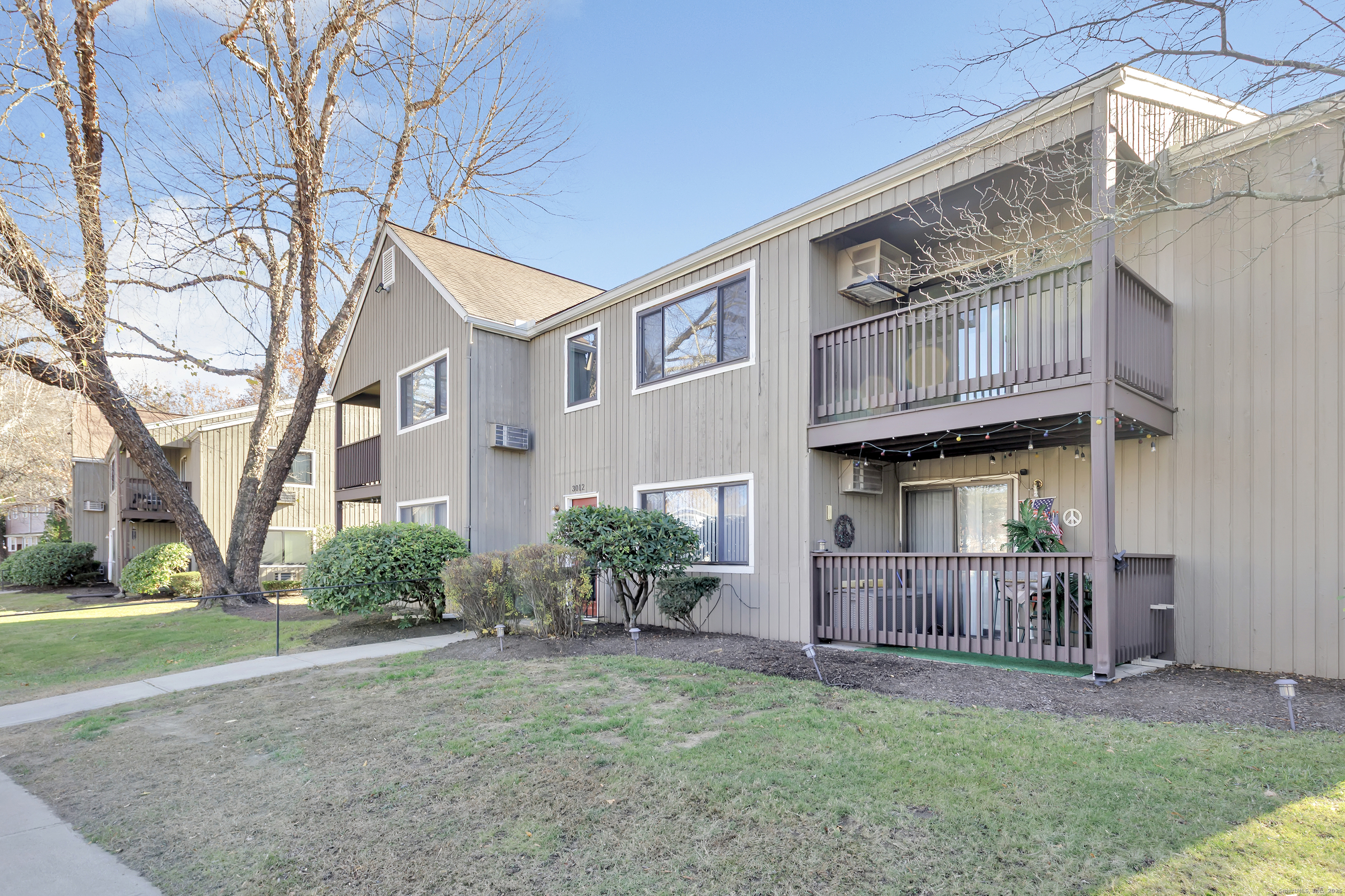 3012 Madison Avenue, Unit F Bridgeport, CT 06606 - Photo 3 of 18 a view of a house with a yard and plants