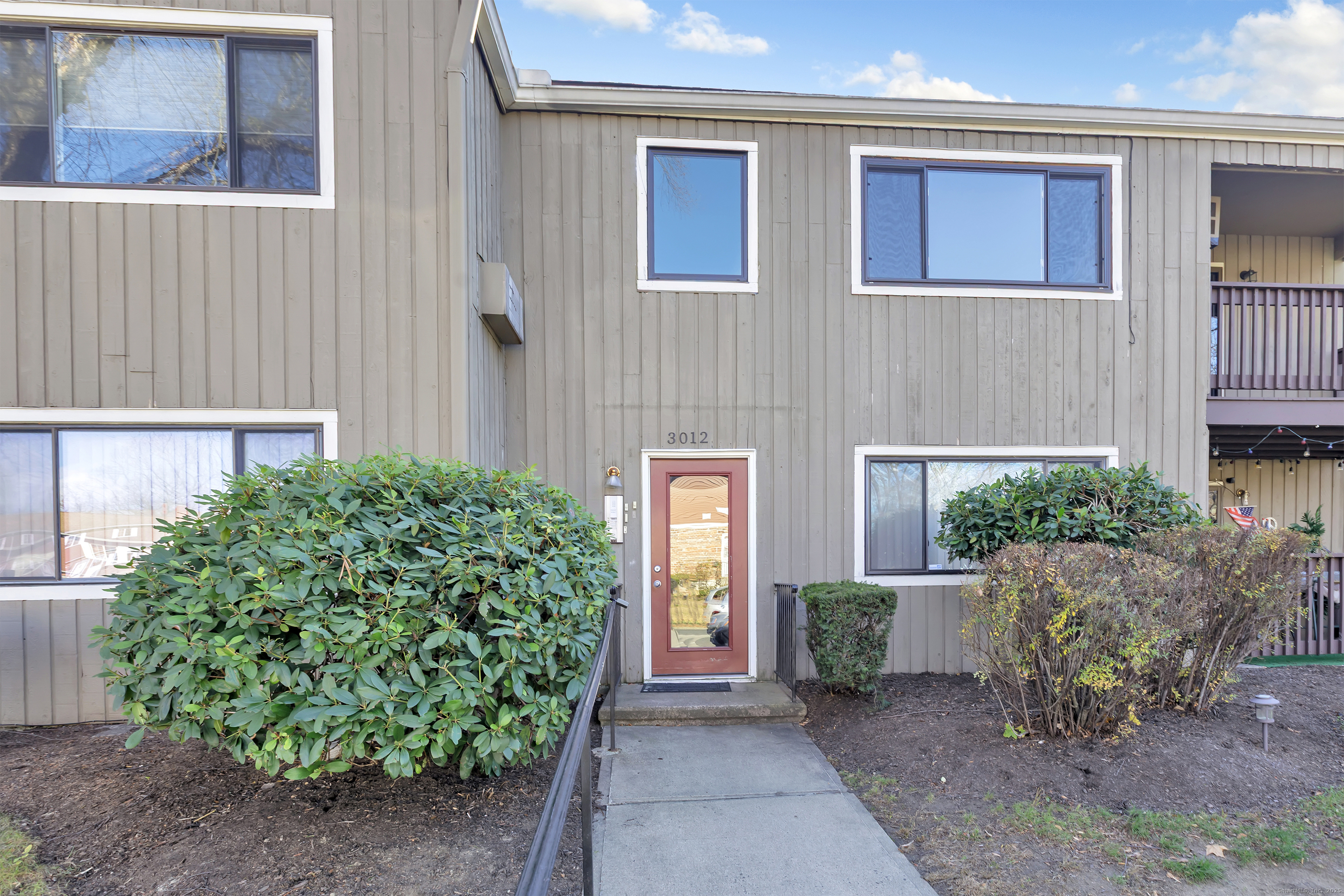 3012 Madison Avenue, Unit F Bridgeport, CT 06606 - Photo 7 of 18 a front view of a house with garden