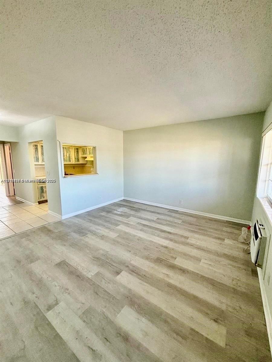 119 Salisbury East, Unit E West Palm Beach, FL 33417 - Photo 2 of 11 a view of empty room