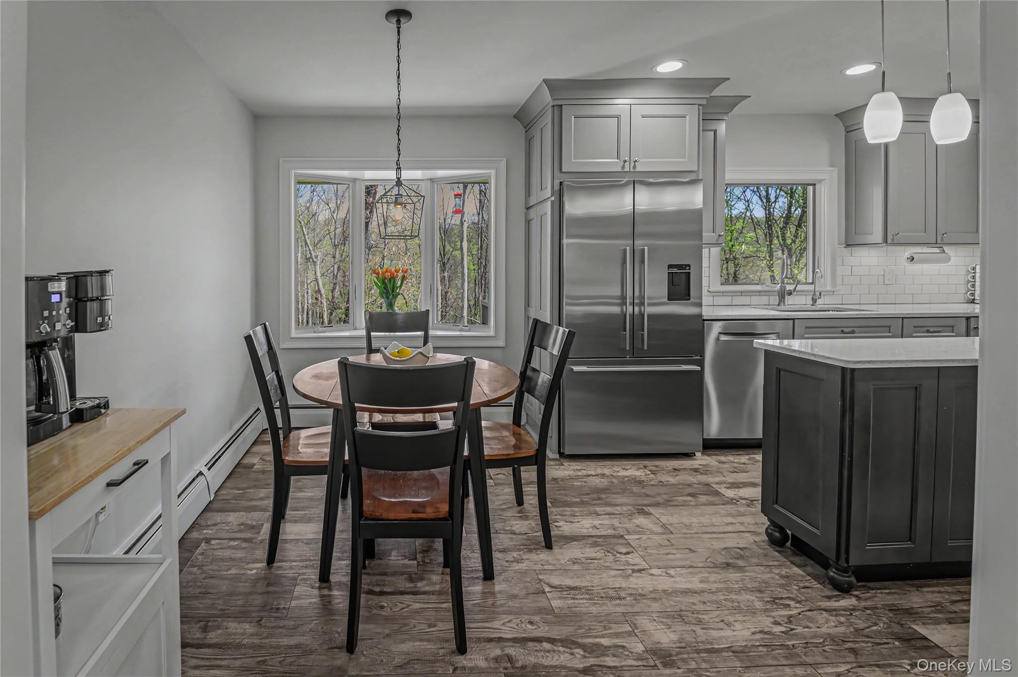 41 Cross Pond Road Pound Ridge, NY 10576 - Photo 12 of 41 a kitchen with a table chairs sink and cabinets