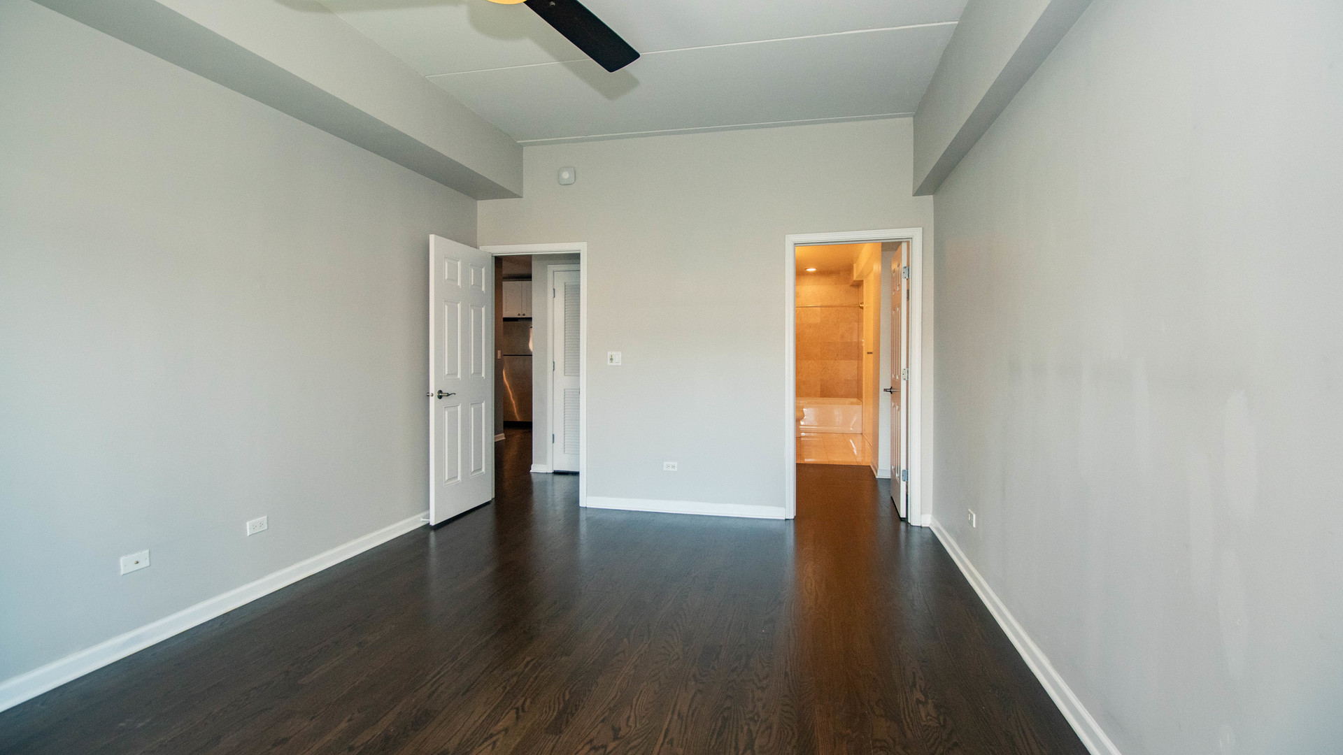 657 West Fulton Street, Unit 412 Chicago, IL 60661 - Photo 16 of 25 an empty room with wooden floor and closet