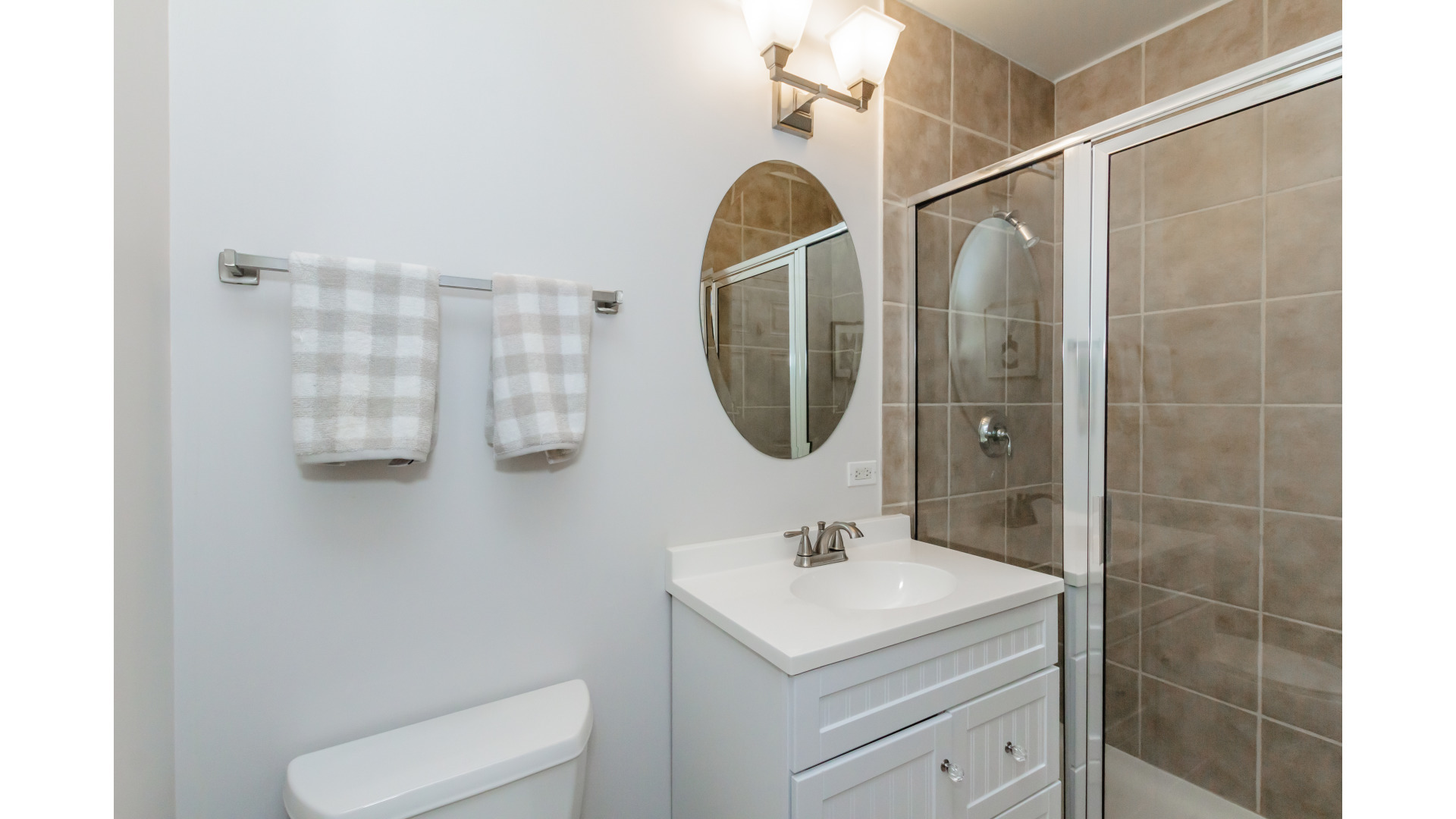 657 West Fulton Street, Unit 412 Chicago, IL 60661 - Photo 21 of 25 a bathroom with a sink toilet and shower
