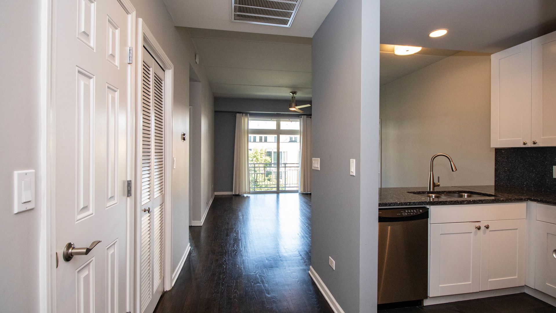 657 West Fulton Street, Unit 412 Chicago, IL 60661 - Photo 22 of 25 a view of a hallway with wooden floor