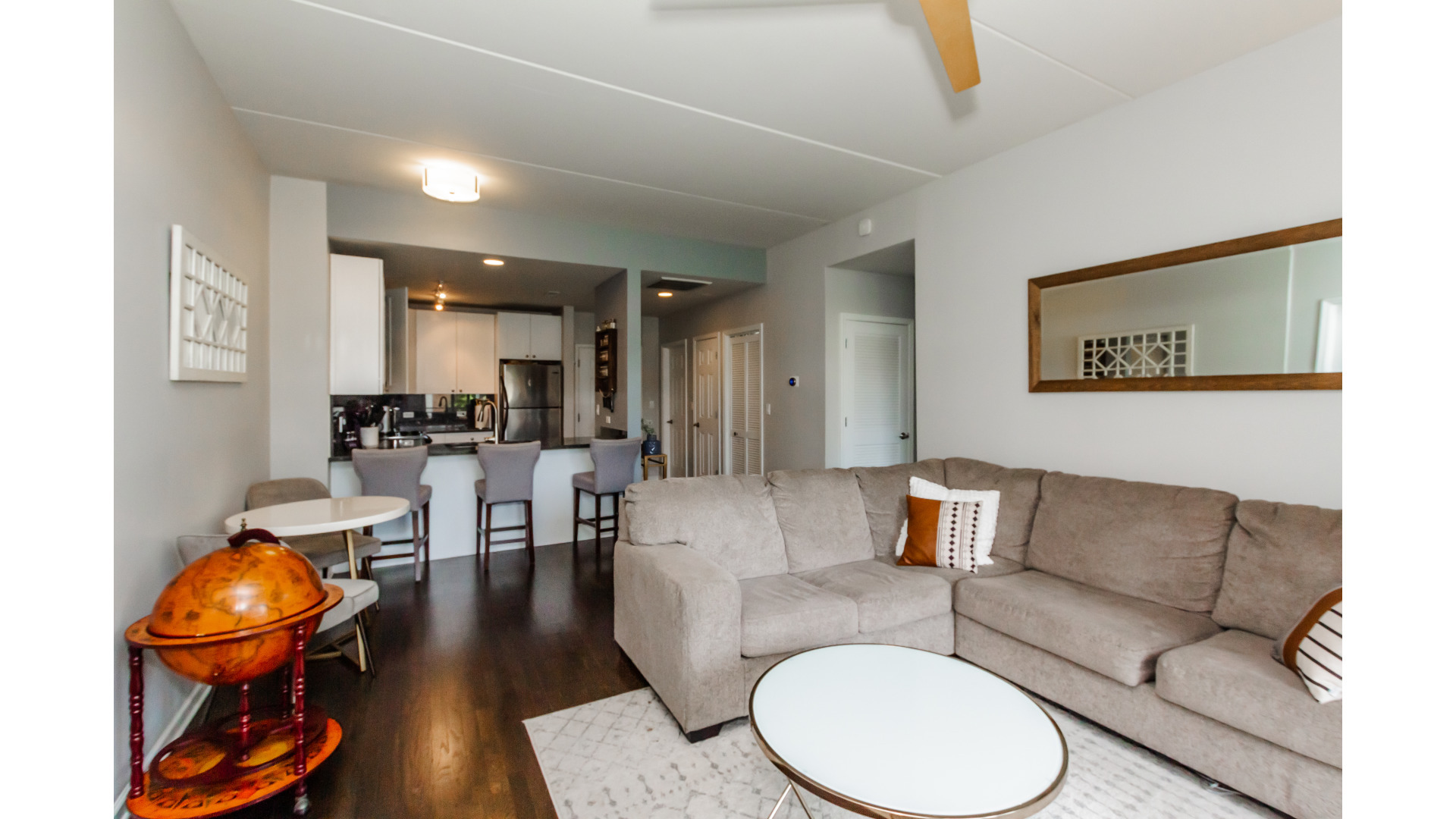 657 West Fulton Street, Unit 412 Chicago, IL 60661 - Photo 7 of 25 a living room with furniture and wooden floor