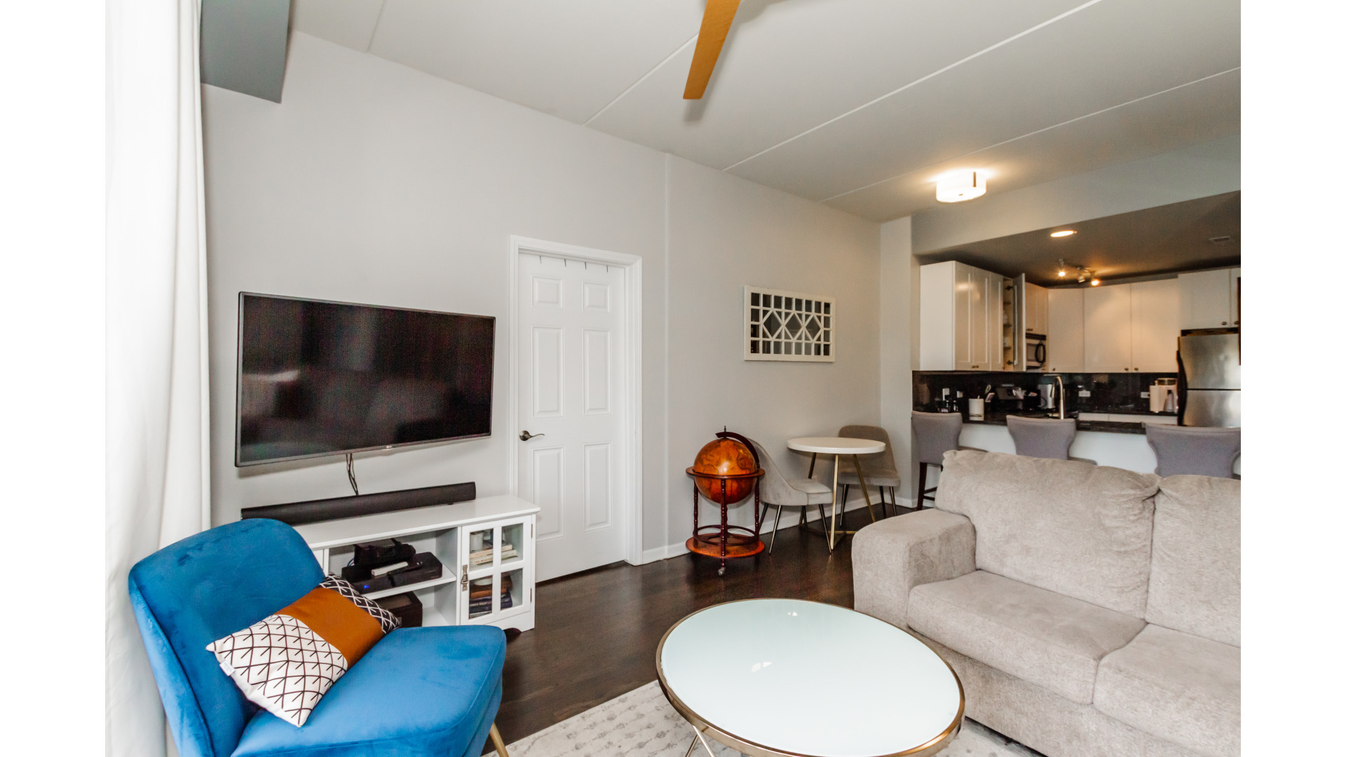 657 West Fulton Street, Unit 412 Chicago, IL 60661 - Photo 8 of 25 a living room with furniture and a flat screen tv