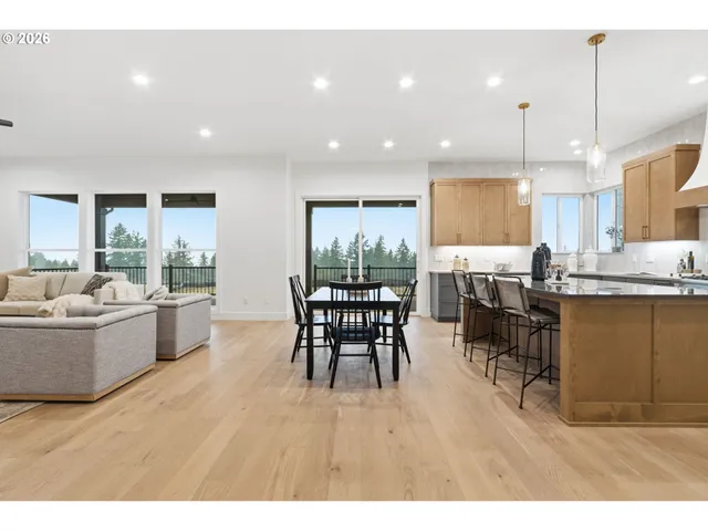 a living room with furniture and kitchen view