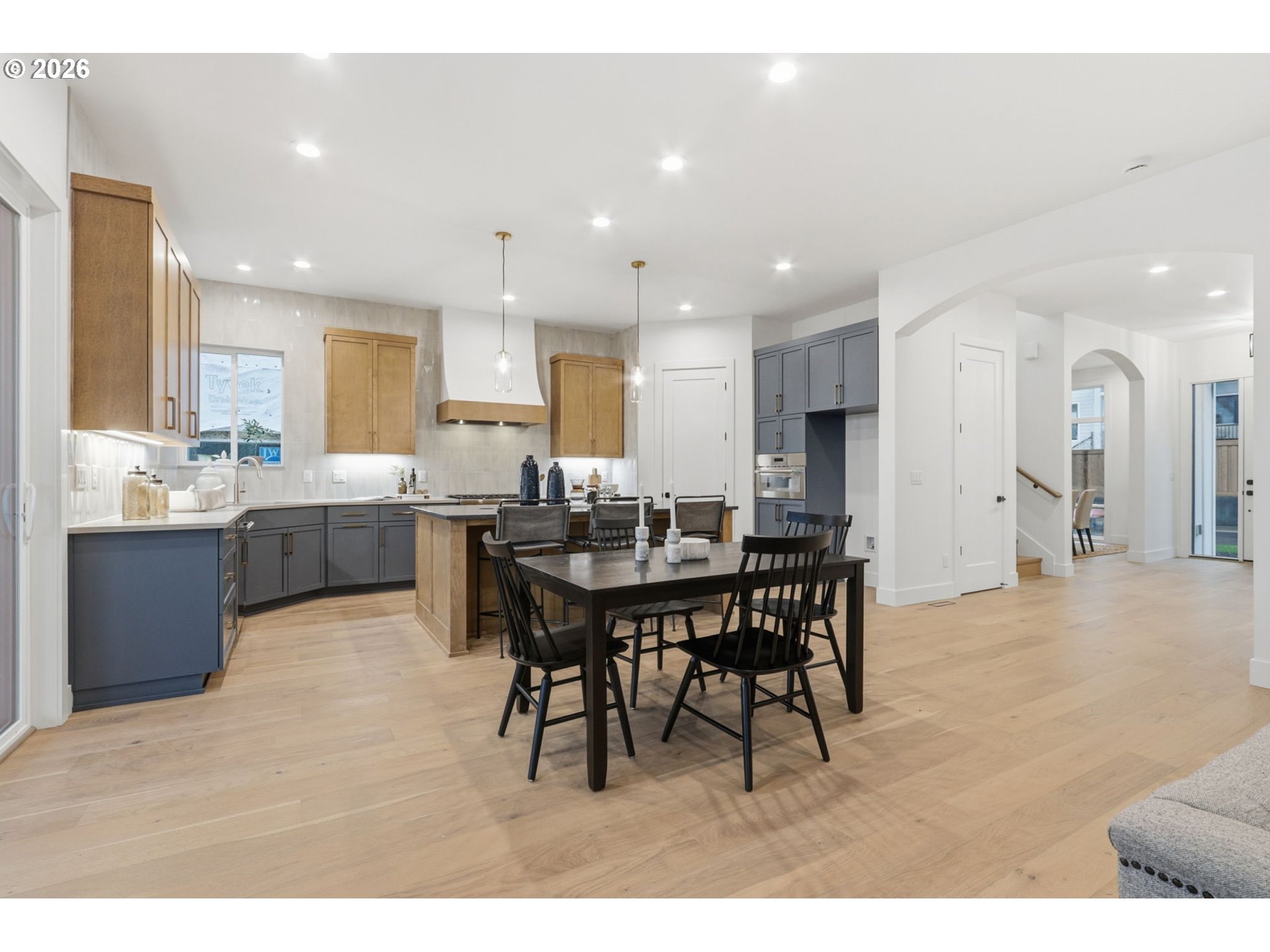 23037 Southwest Curry Rdg Drive Sherwood, OR 97140 - Photo 15 of 48 a large kitchen with a table and chairs