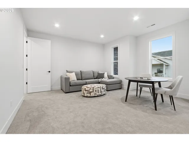 a living room with furniture and a table