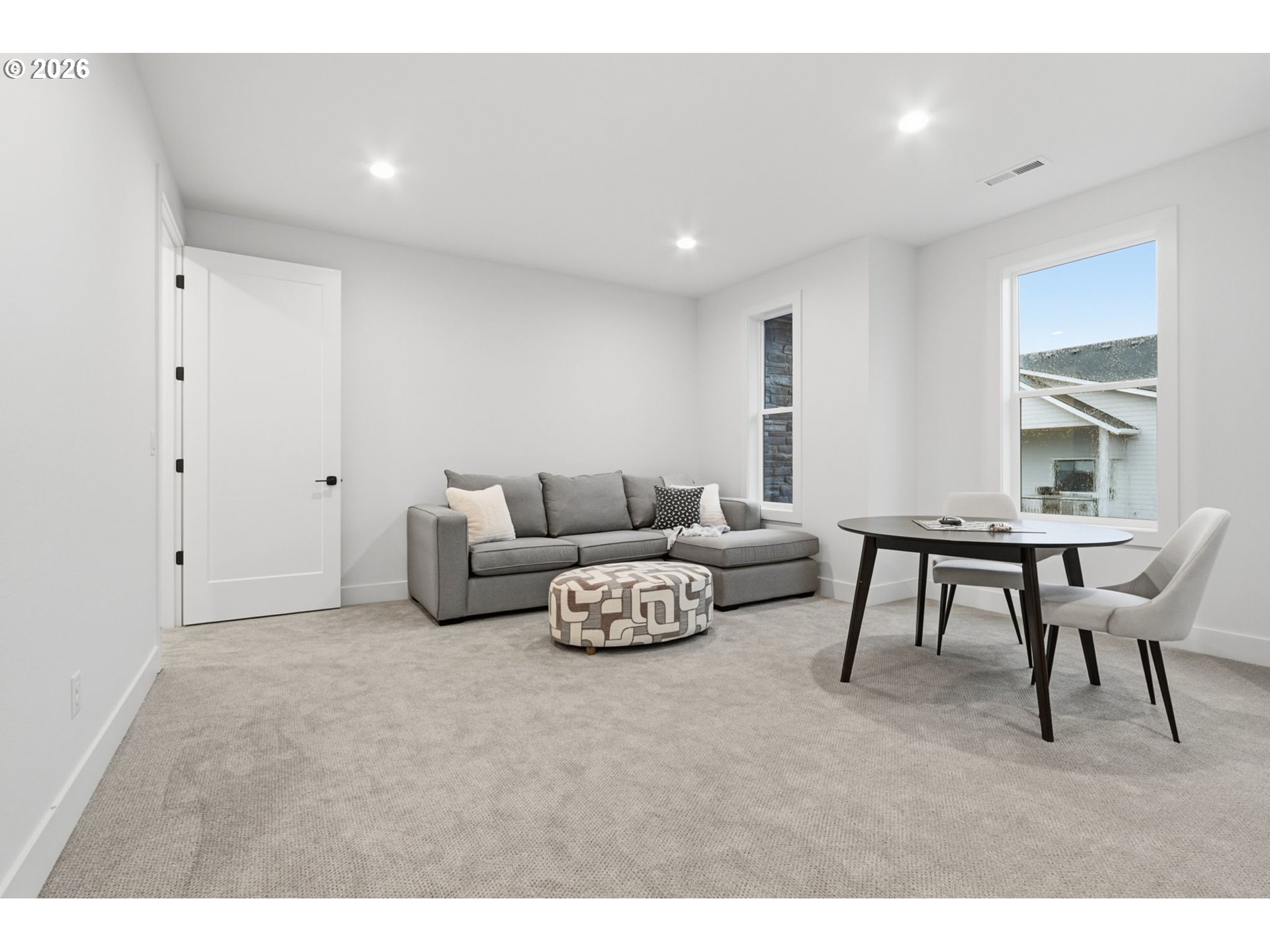 23037 Southwest Curry Rdg Drive Sherwood, OR 97140 - Photo 29 of 48 a living room with furniture and a table