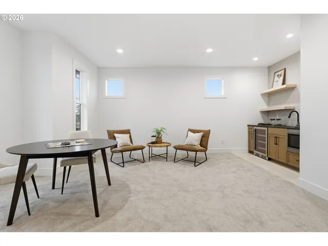 a view of a workspace with furniture