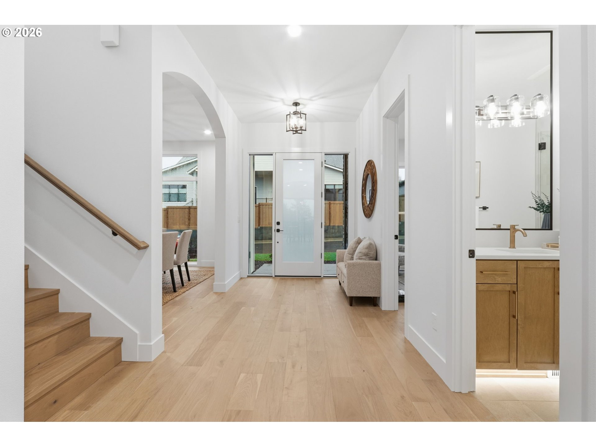 23037 Southwest Curry Rdg Drive Sherwood, OR 97140 - Photo 3 of 48 a hall way with furniture and wooden floor