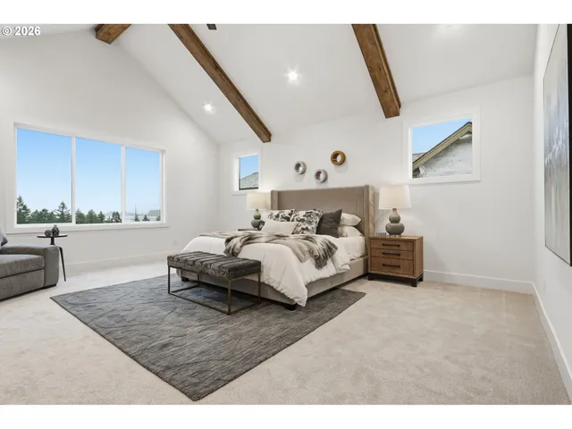 a spacious bedroom with a bed and a couch