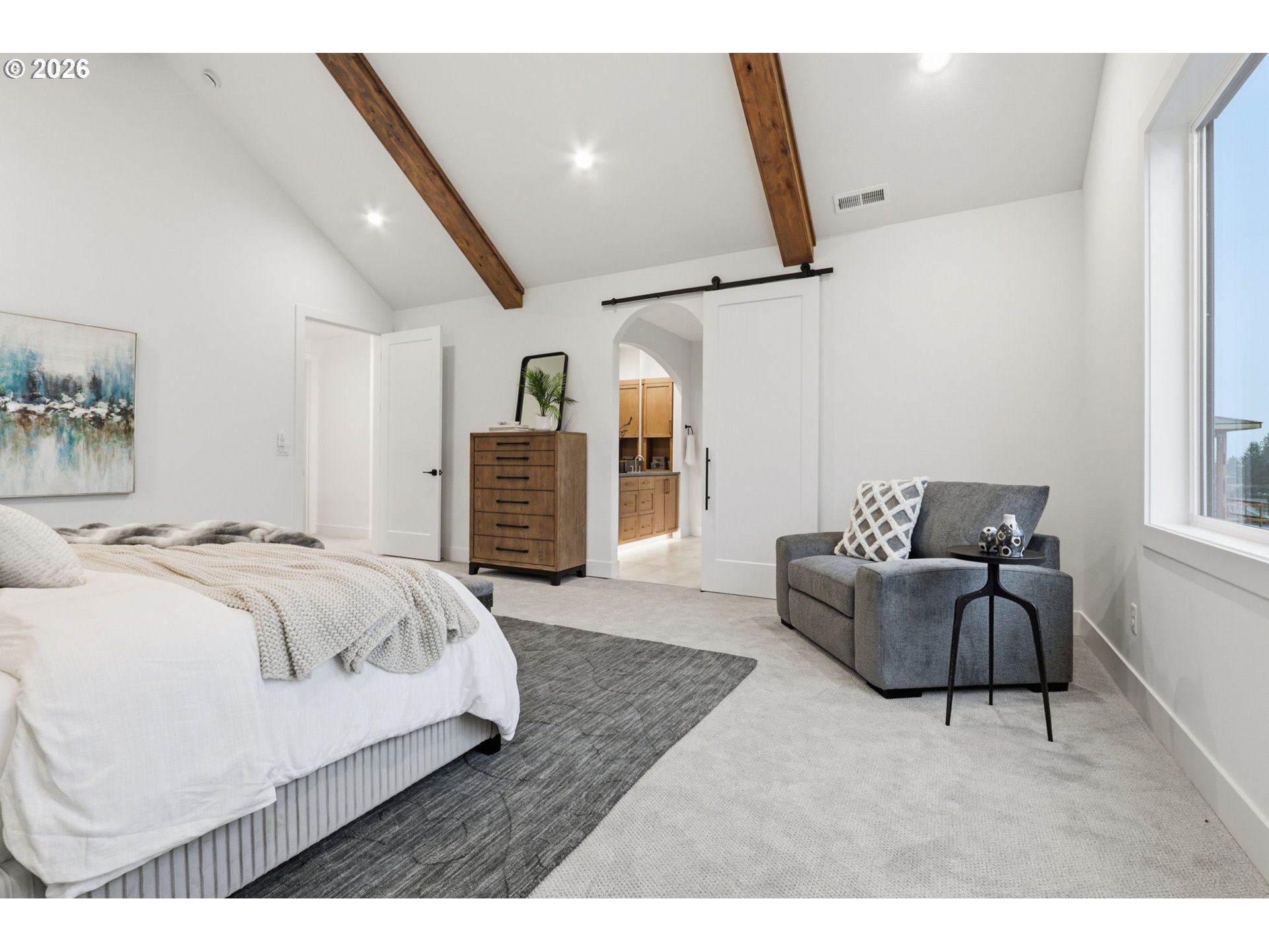 23037 Southwest Curry Rdg Drive Sherwood, OR 97140 - Photo 36 of 48 a spacious bedroom with a bed a couch and dresser