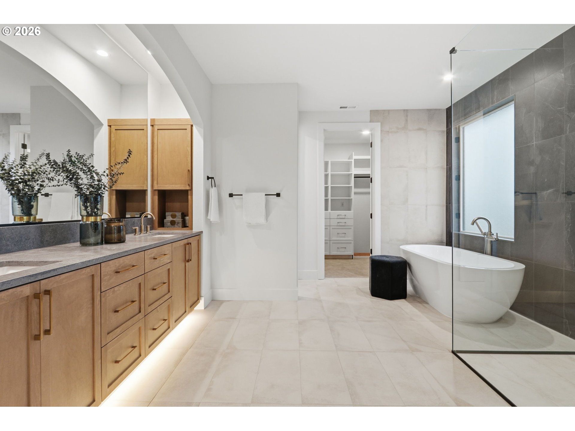 23037 Southwest Curry Rdg Drive Sherwood, OR 97140 - Photo 37 of 48 a spacious bathroom with a double vanity sink a mirror and a bathtub