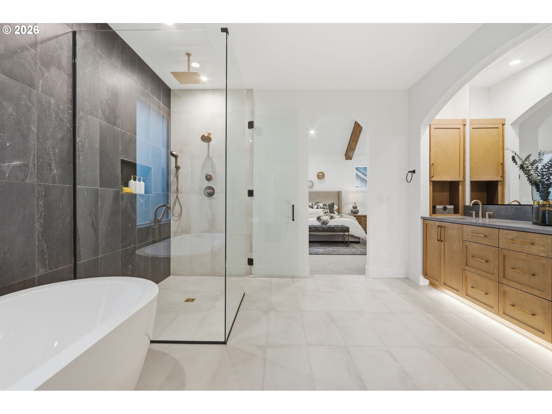 23037 Southwest Curry Rdg Drive Sherwood, OR 97140 - Photo 41 of 48 a bathroom with a tub a sink and mirrors
