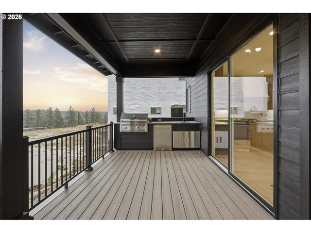 a view of a wooden balcony with a sink
