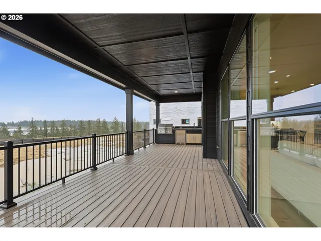 a view of balcony with wooden floor
