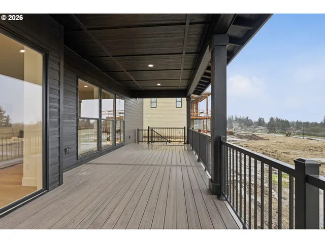 a view of balcony with floor to ceiling windows with wooden floor