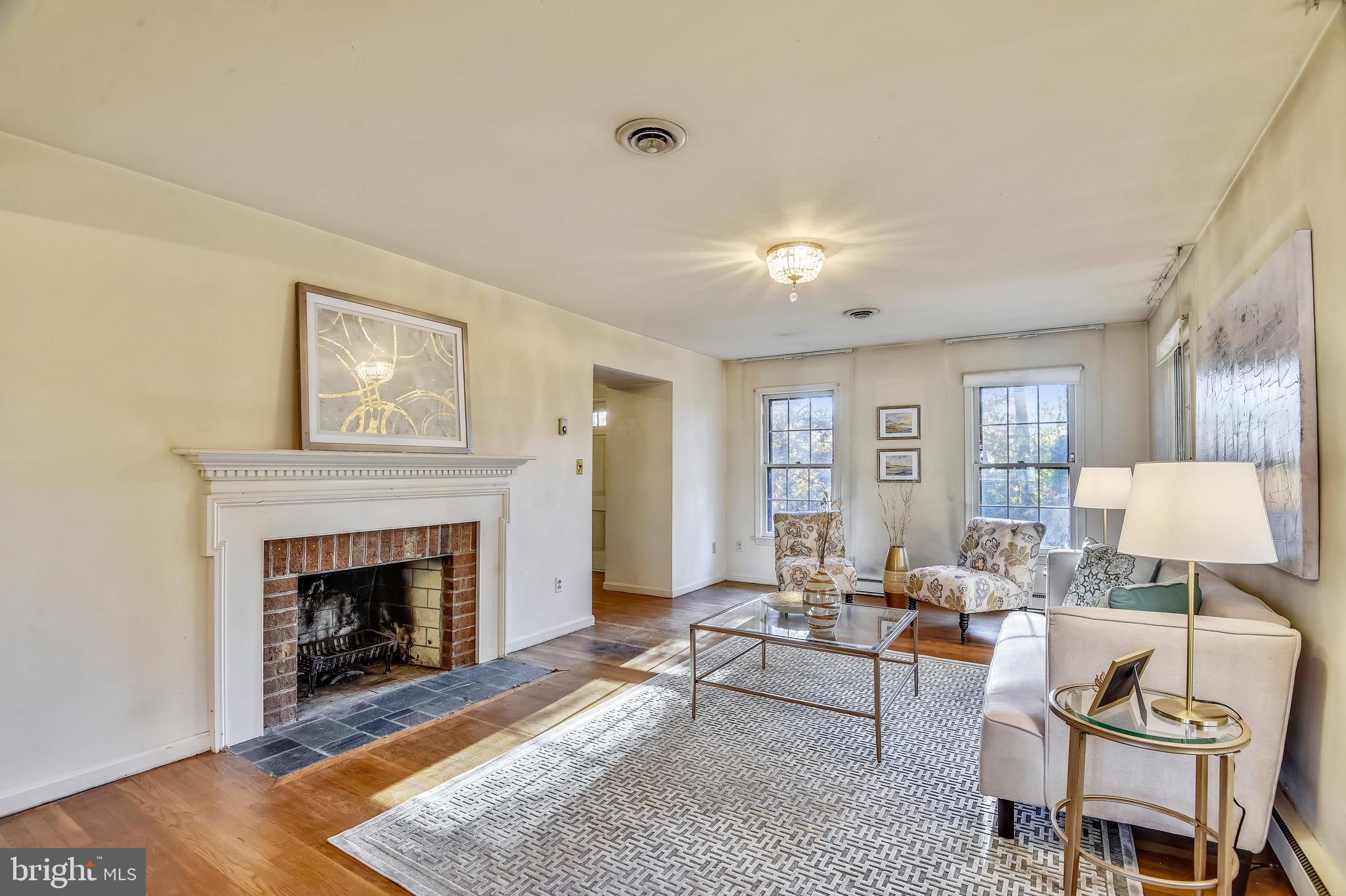 11342 Vale Road Oakton, VA 22124 - Photo 6 of 34 Spacious Living Room with Wood-burning Fireplace