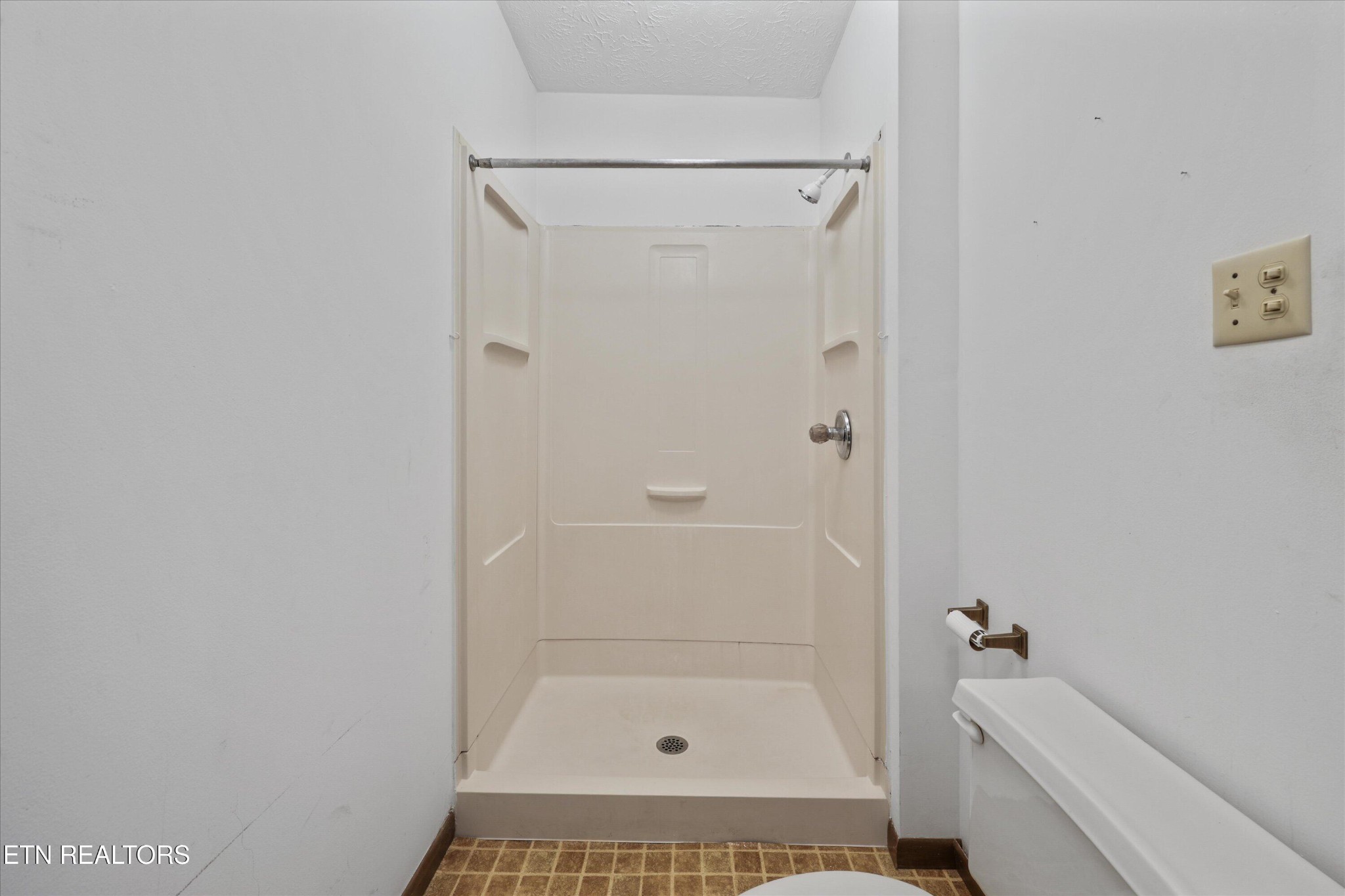 359 East Wolf Valley Road Heiskell, TN 37754 - Photo 15 of 40 a bathroom with a tub shower vanity and a sink