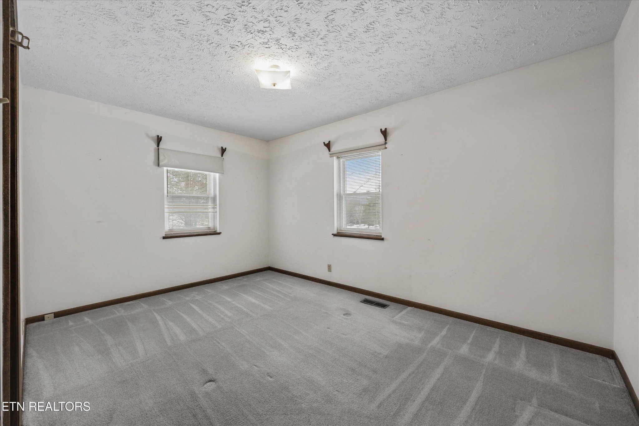 359 East Wolf Valley Road Heiskell, TN 37754 - Photo 16 of 40 an empty room with windows