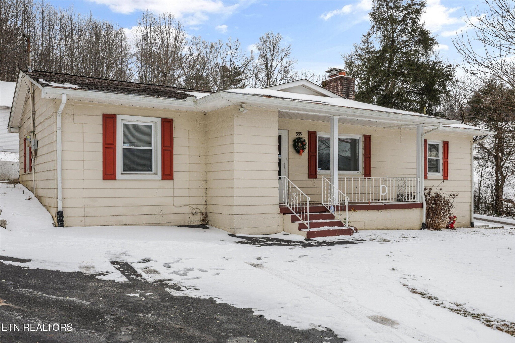 359 East Wolf Valley Road Heiskell, TN 37754 - Photo 2 of 40 a view of a house with snow on the road