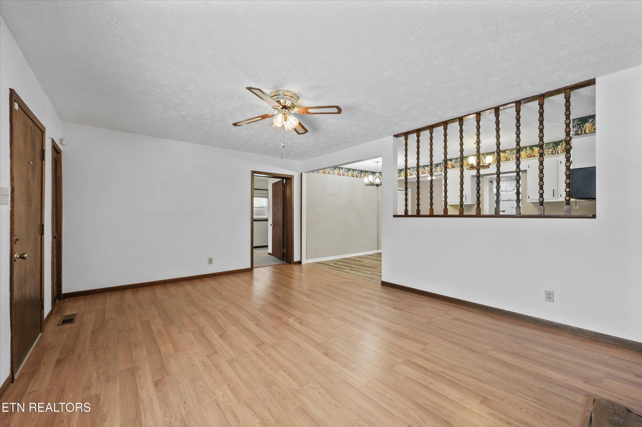 359 East Wolf Valley Road Heiskell, TN 37754 - Photo 6 of 40 a view of an empty room with a window and wooden floor