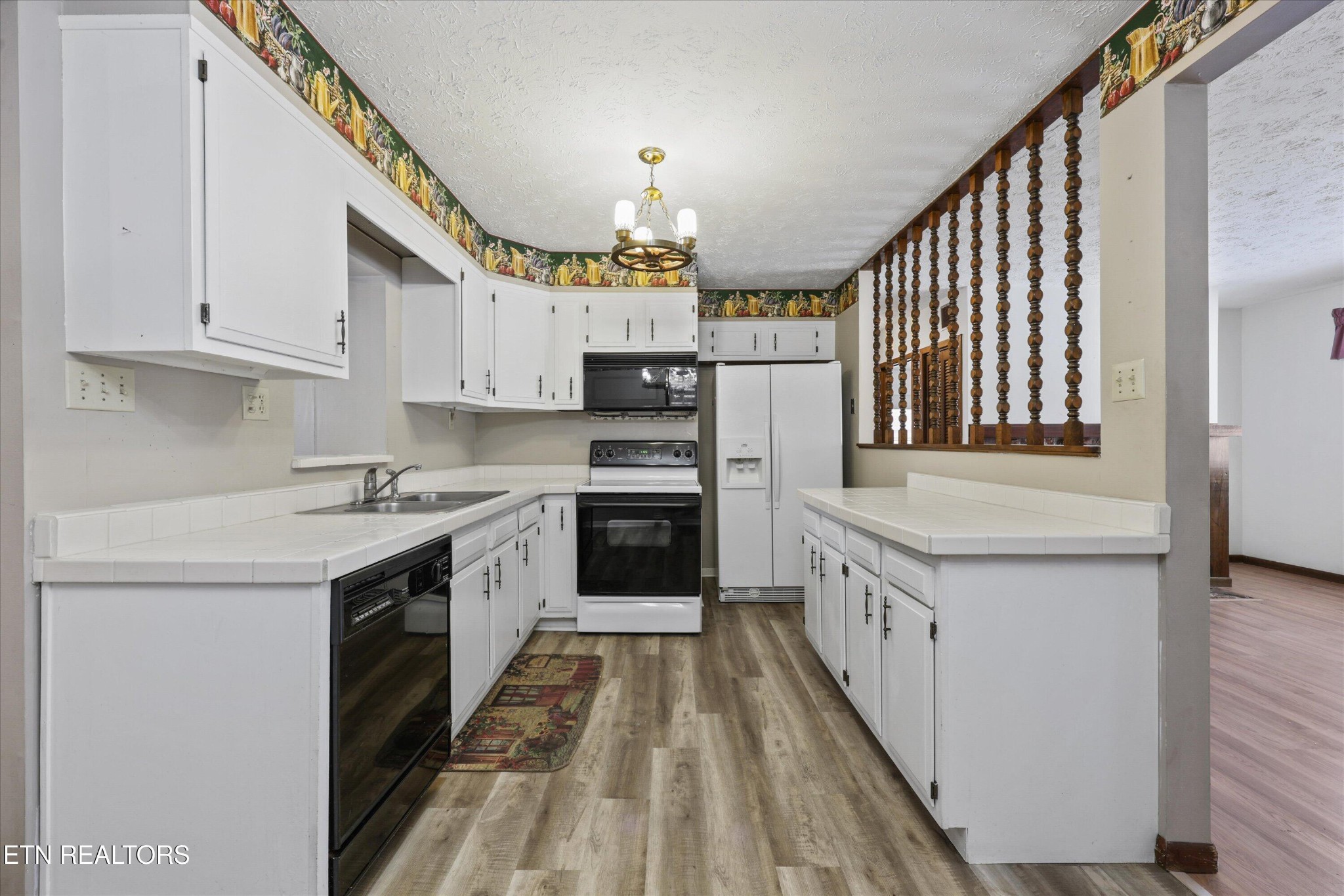 359 East Wolf Valley Road Heiskell, TN 37754 - Photo 9 of 40 a kitchen with granite countertop a stove and a sink