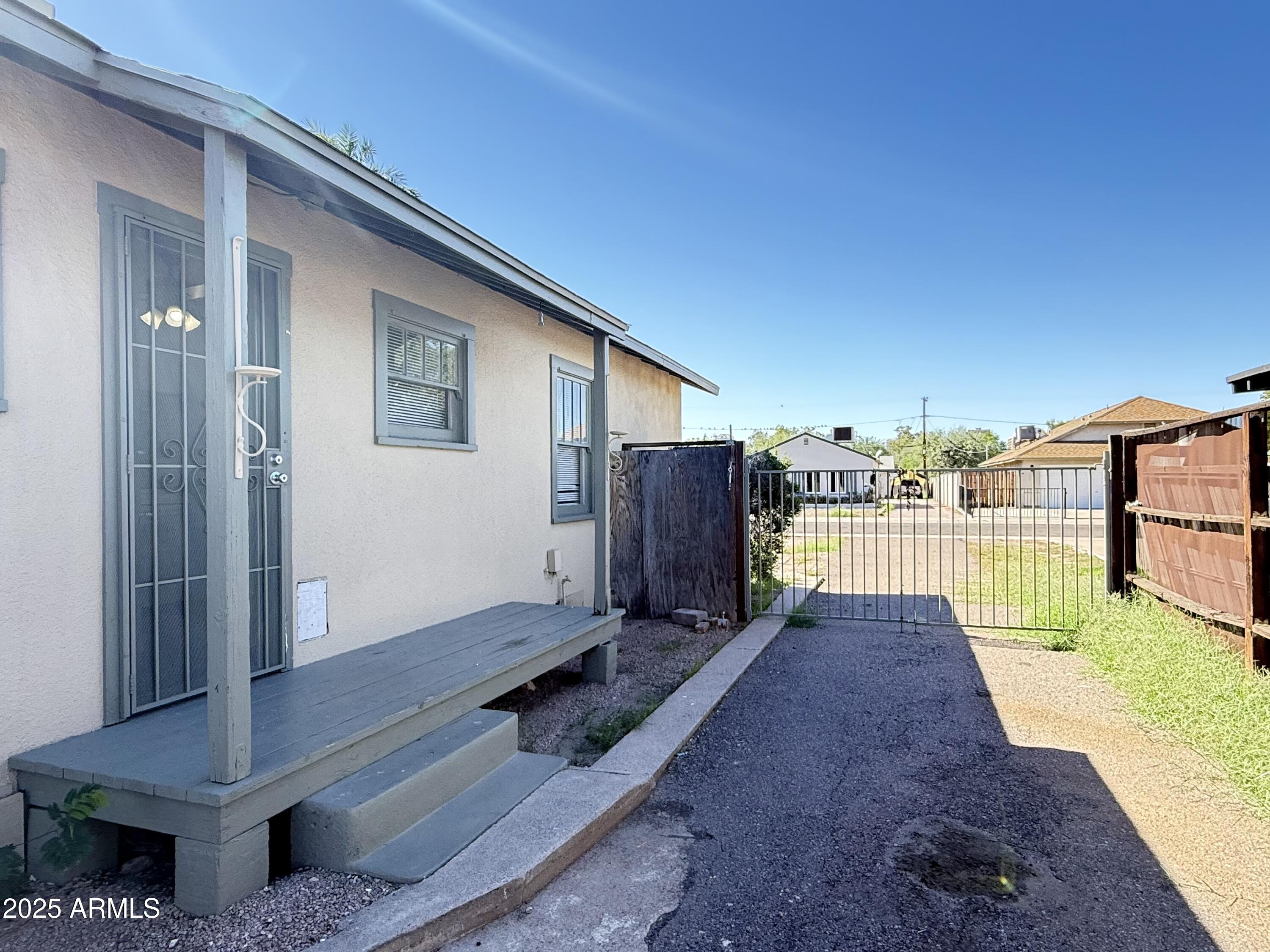 3809 North 9th Place Phoenix, AZ 85014 - Photo 26 of 28 a view of a backyard with wooden floor and fence