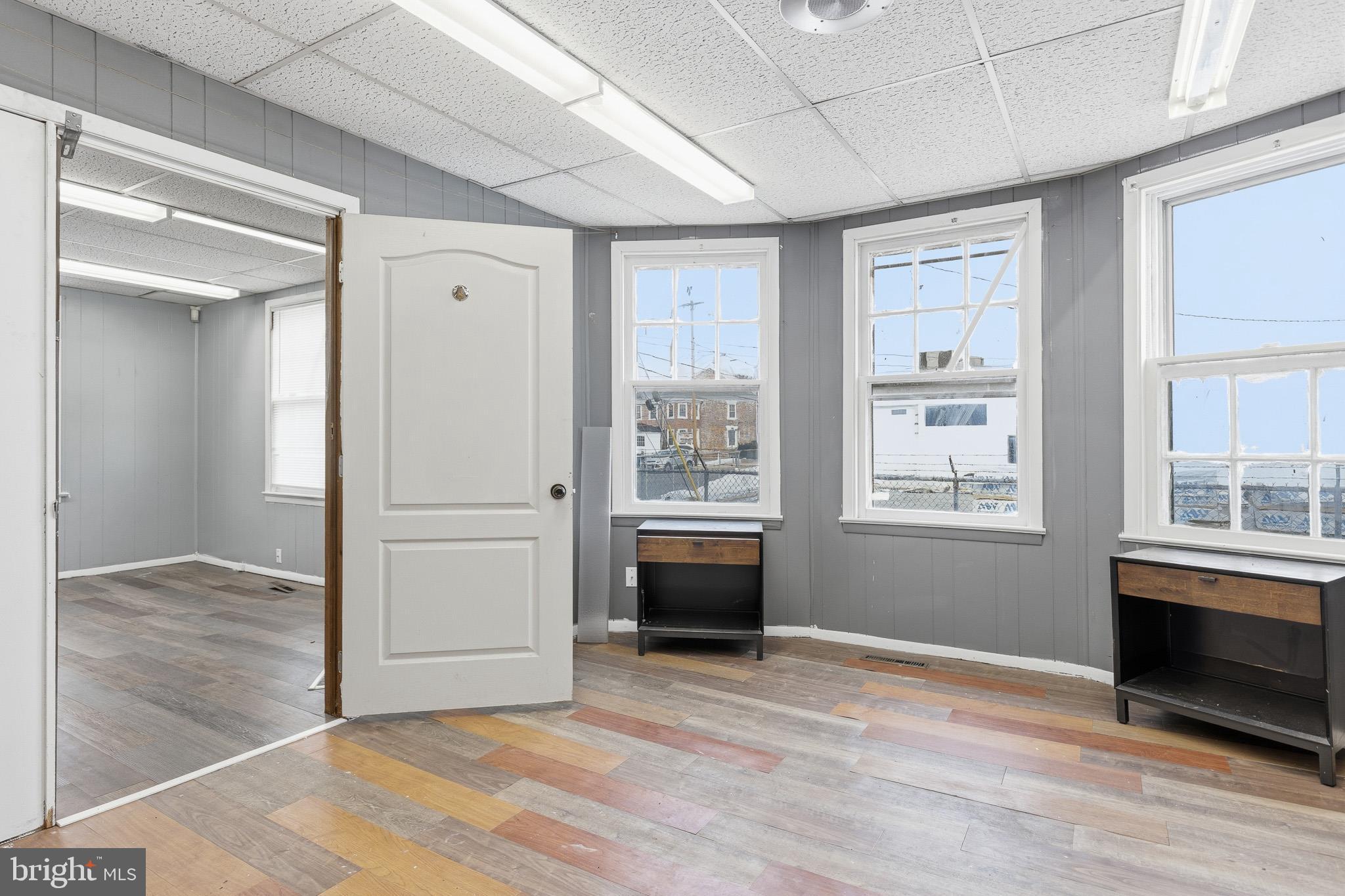 212 West Main Street Elkton, MD 21921 - Photo 11 of 35 a view of an empty room with wooden floor and a window
