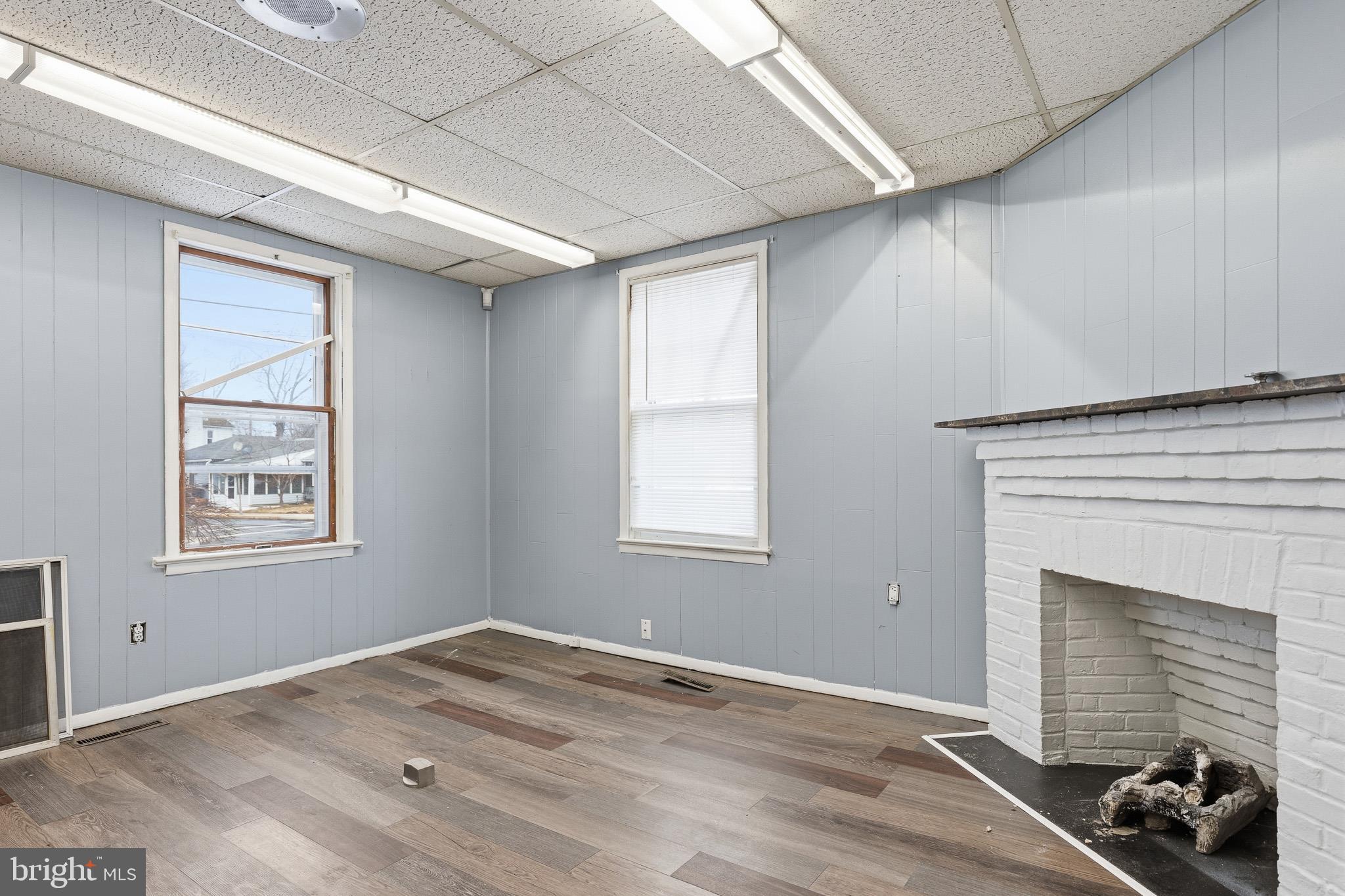 212 West Main Street Elkton, MD 21921 - Photo 21 of 35 an empty room with windows and fireplace