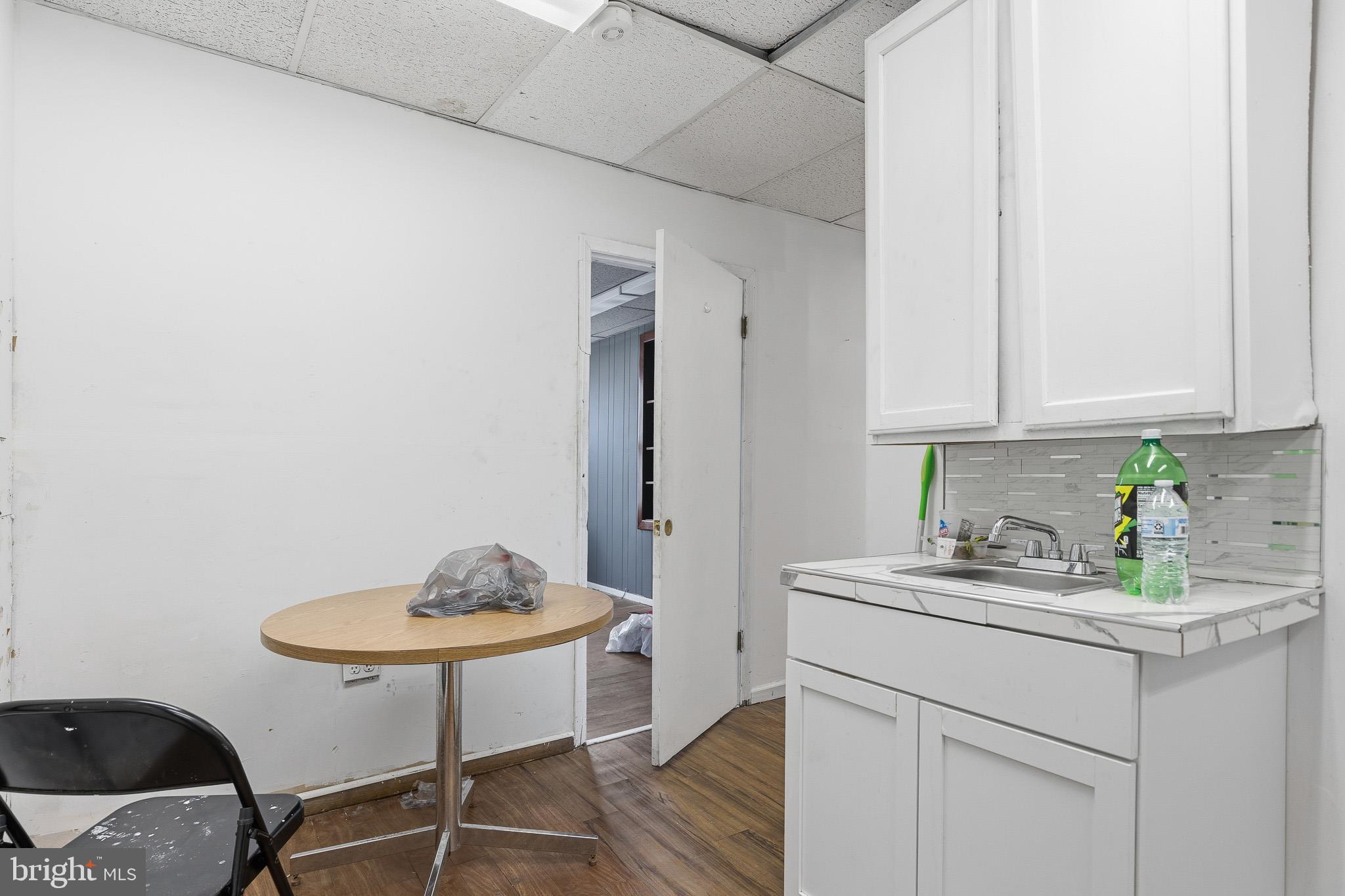 212 West Main Street Elkton, MD 21921 - Photo 23 of 35 a kitchen with a sink cabinets and wooden floor
