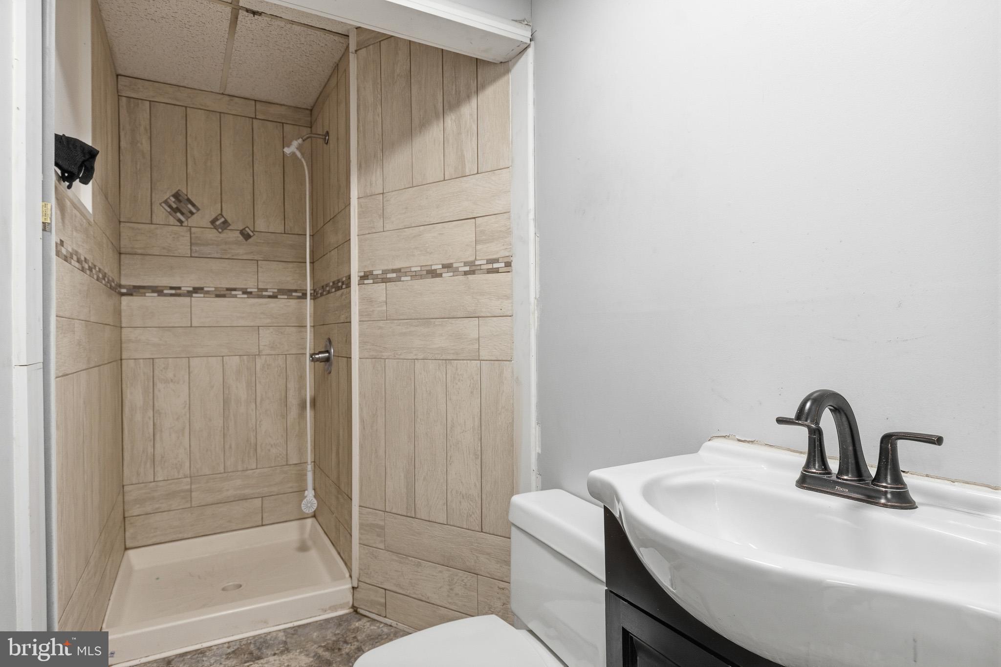212 West Main Street Elkton, MD 21921 - Photo 26 of 35 a bathroom with a sink and mirror